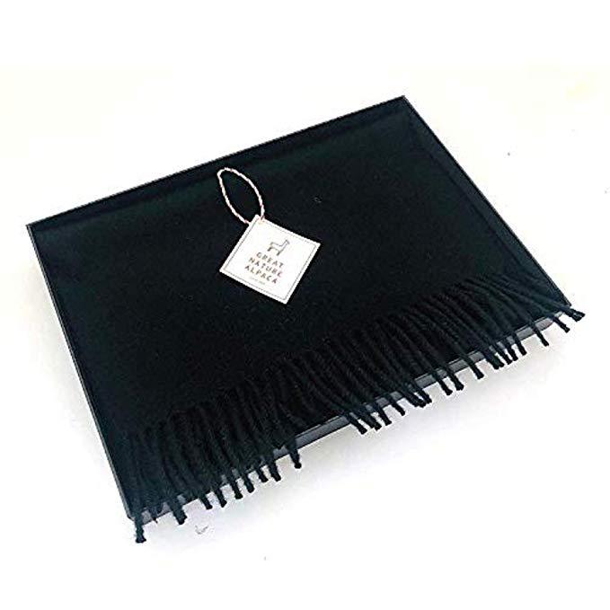 Luxurious black scarf made from 100% super baby alpaca wool, showcasing its soft texture and elegant design.