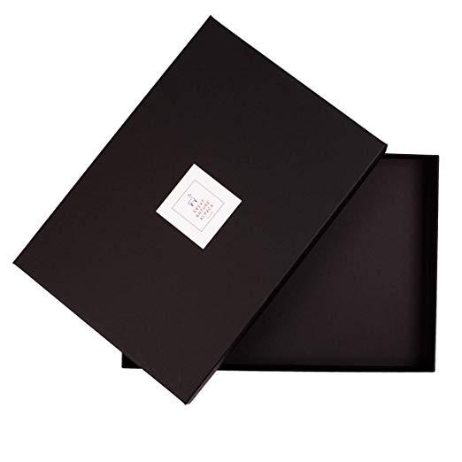 Luxurious white shawl made from 70% baby alpaca and 30% silk, showcasing its soft texture and elegant design.