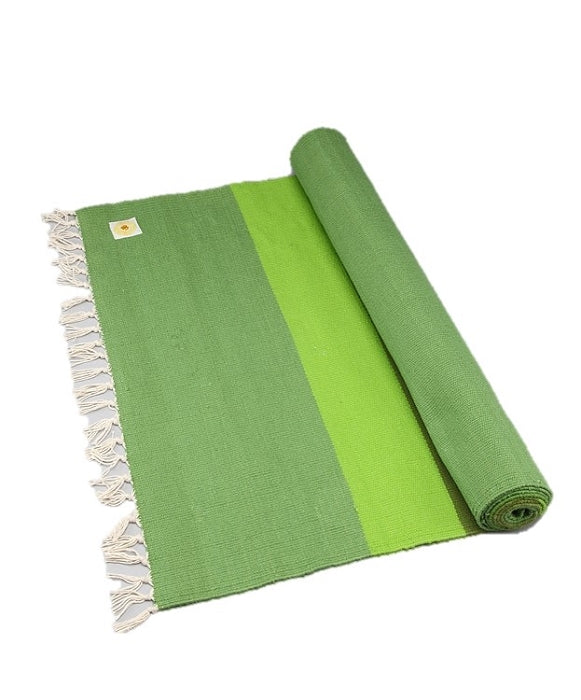 Handwoven cotton yoga rug featuring OM design, fringes, and vibrant colors, ideal for meditation and yoga practice.