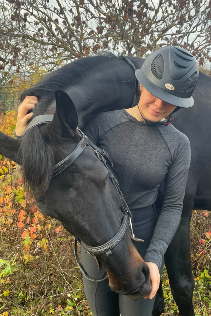 LANA grey unisex merino wool thermal blouse displayed on a mannequin, showcasing its soft texture and seamless design.