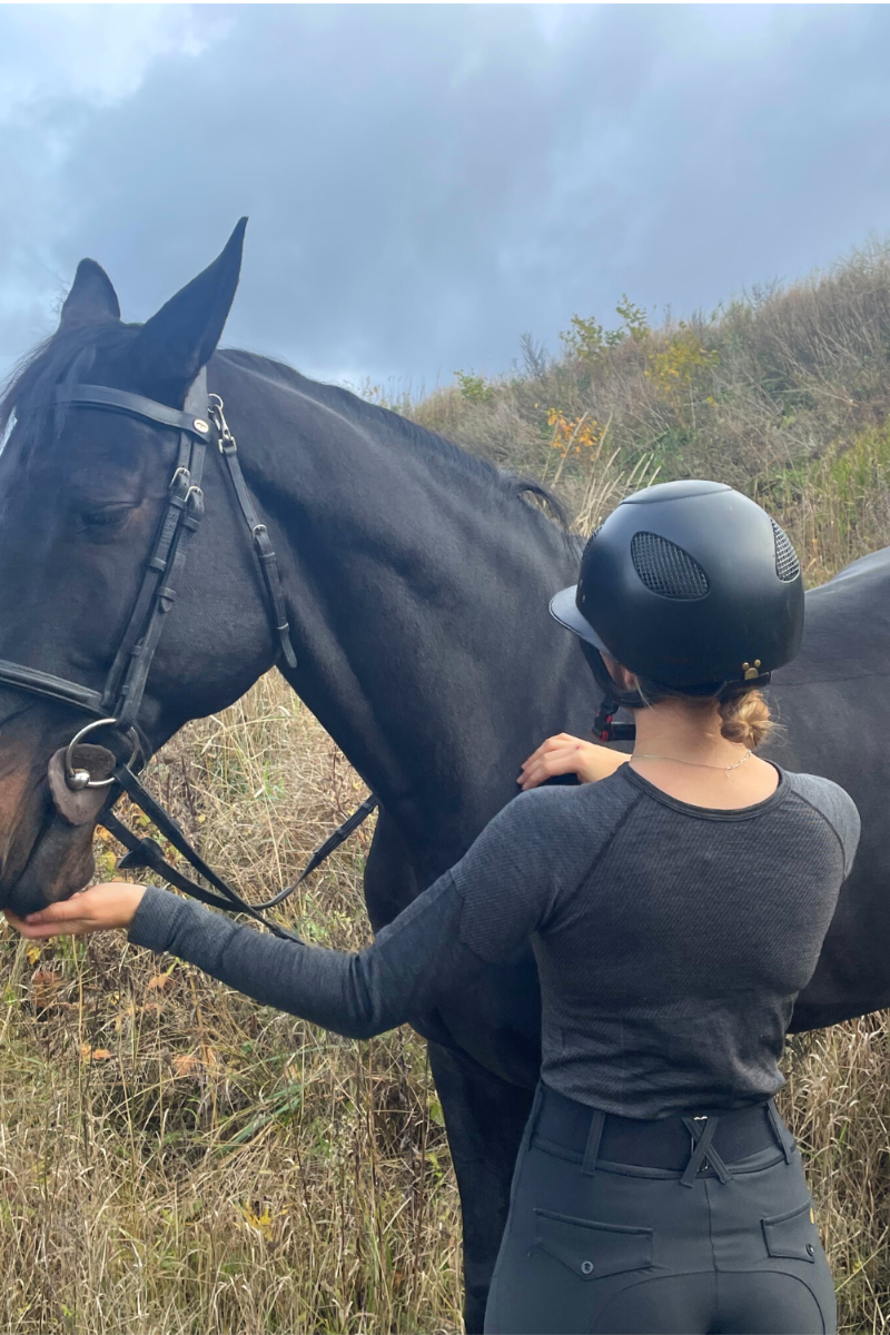 LANA grey unisex merino wool thermal blouse displayed on a mannequin, showcasing its soft texture and seamless design.