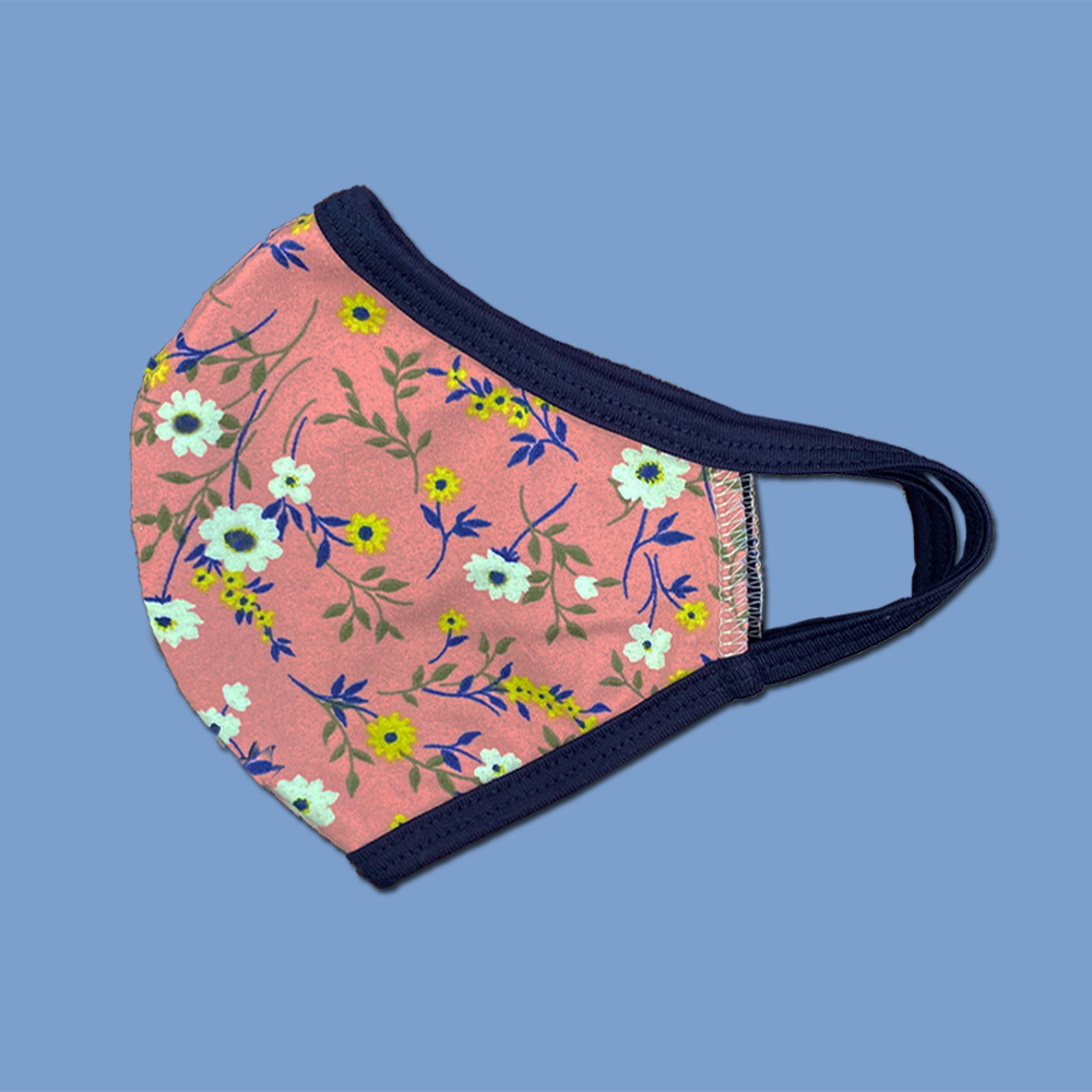 Pack of 25 floral fabric face masks featuring vibrant designs, made from a heavy cotton blend for comfort and durability.
