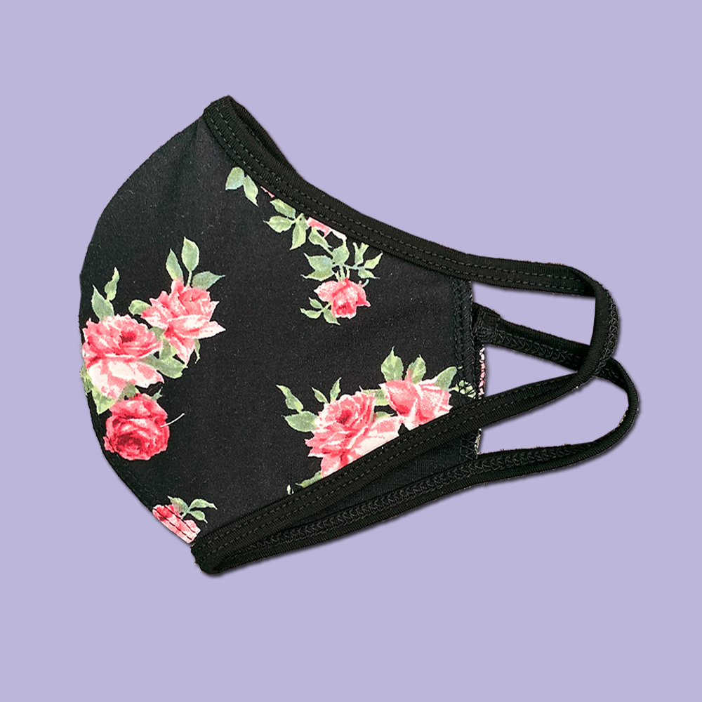 Pack of 25 floral fabric face masks featuring vibrant designs, made from a heavy cotton blend for comfort and durability.