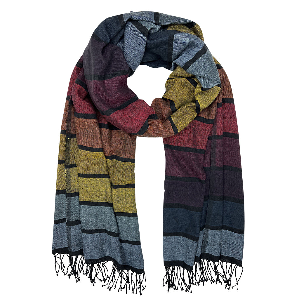 A vibrant Rainbow Wrap Scarf made from pure Ethiopian cotton with black fringe edges, showcasing its unique design and craftsmanship.