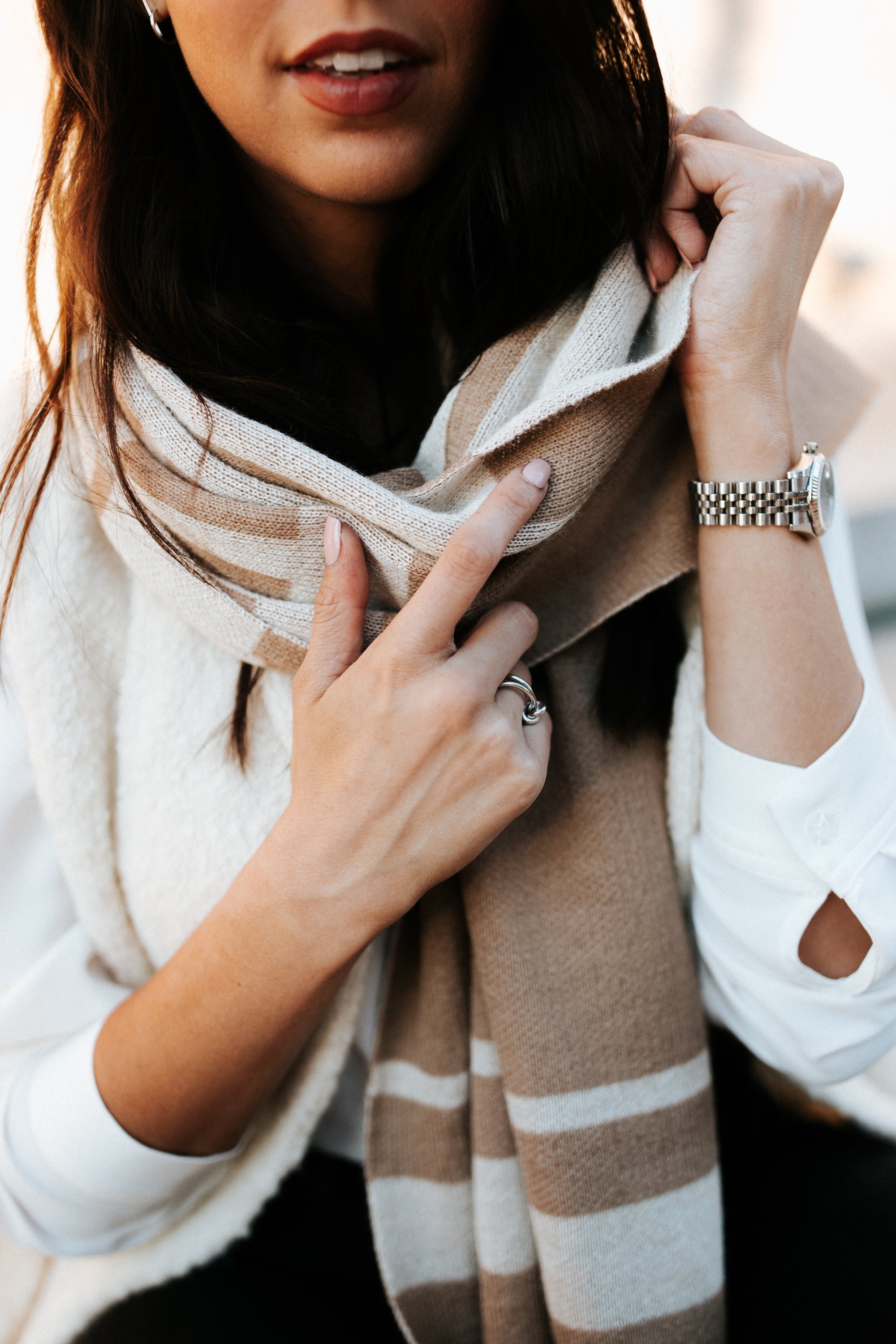 Reversible Lines Baby Alpaca fleece shawl in Black & Ivory and Sand & Ivory, showcasing its soft texture and unique two-sided pattern.