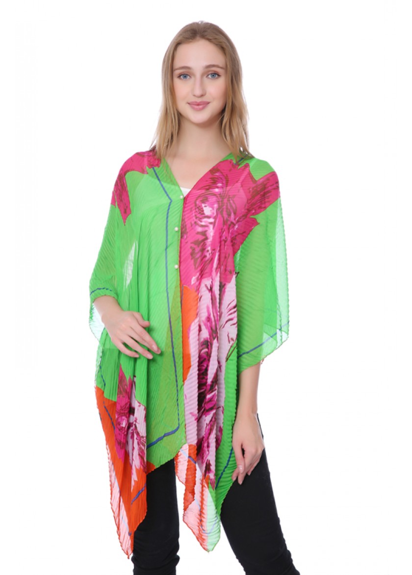 Woman wearing colorful floral tunic.