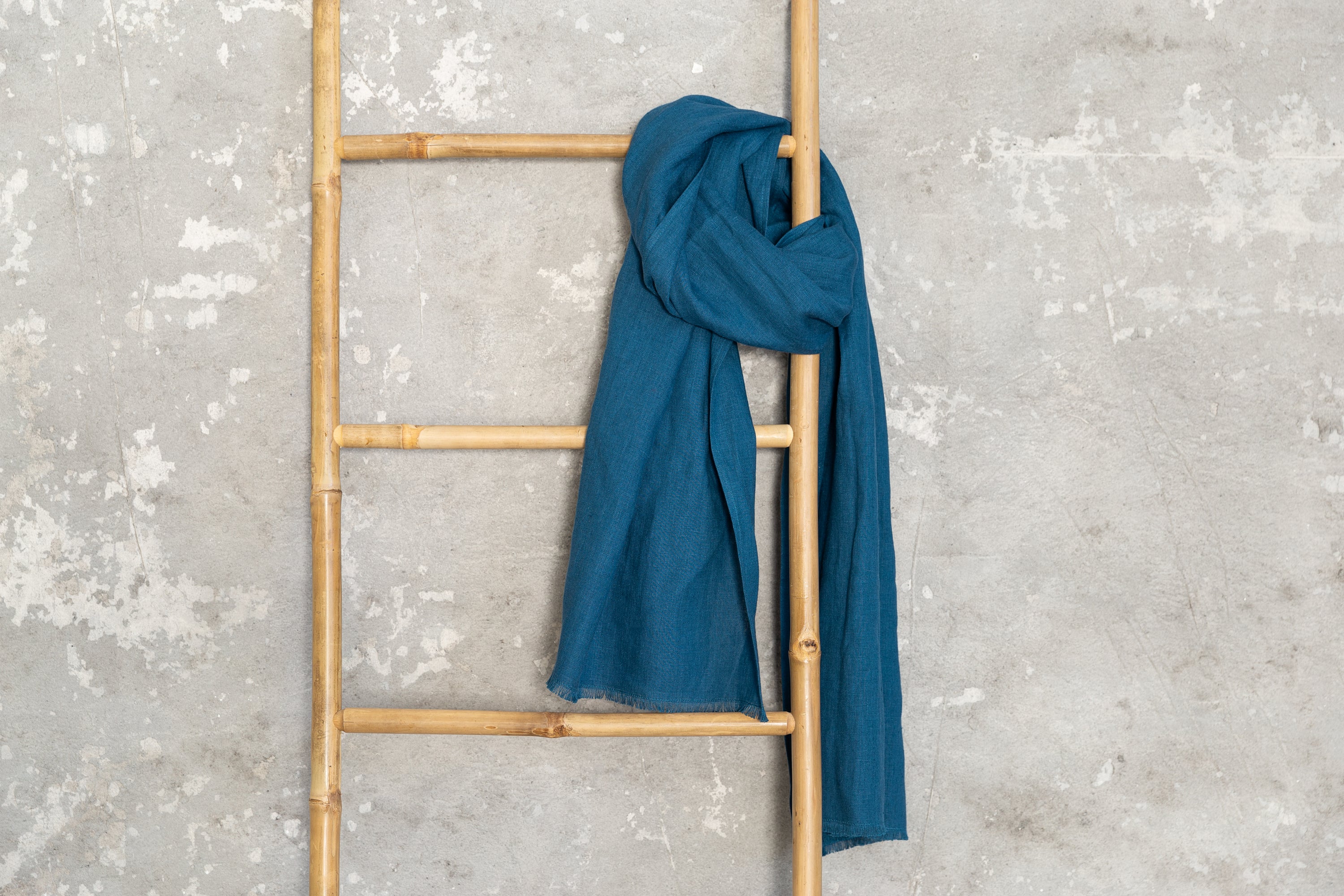 Sky Blue linen scarf made from 100% stonewashed linen, featuring a soft texture and available in two sizes with stylish hem or tassels.
