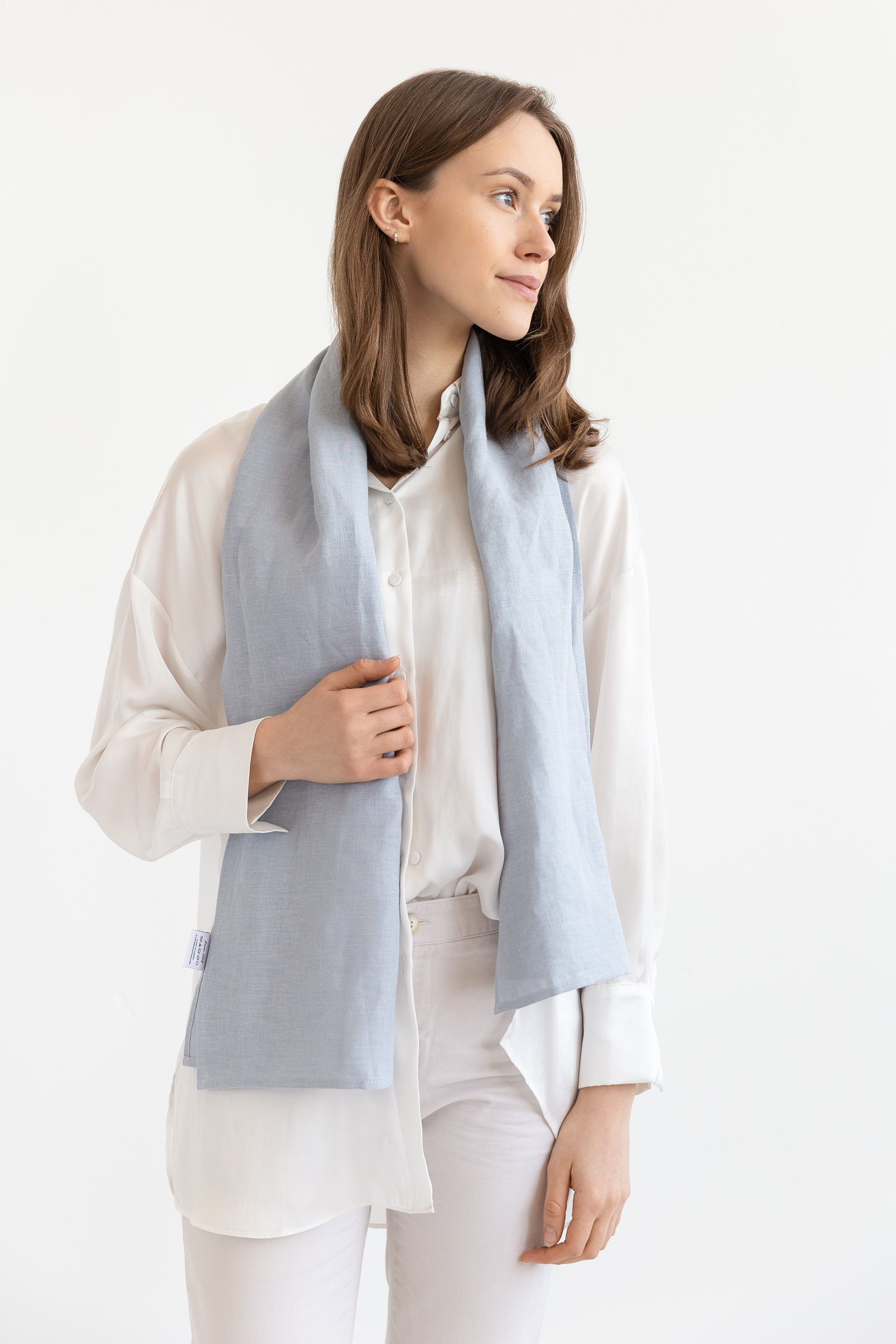 Sky Blue linen scarf made from 100% stonewashed linen, featuring a soft texture and available in two sizes with stylish hem or tassels.