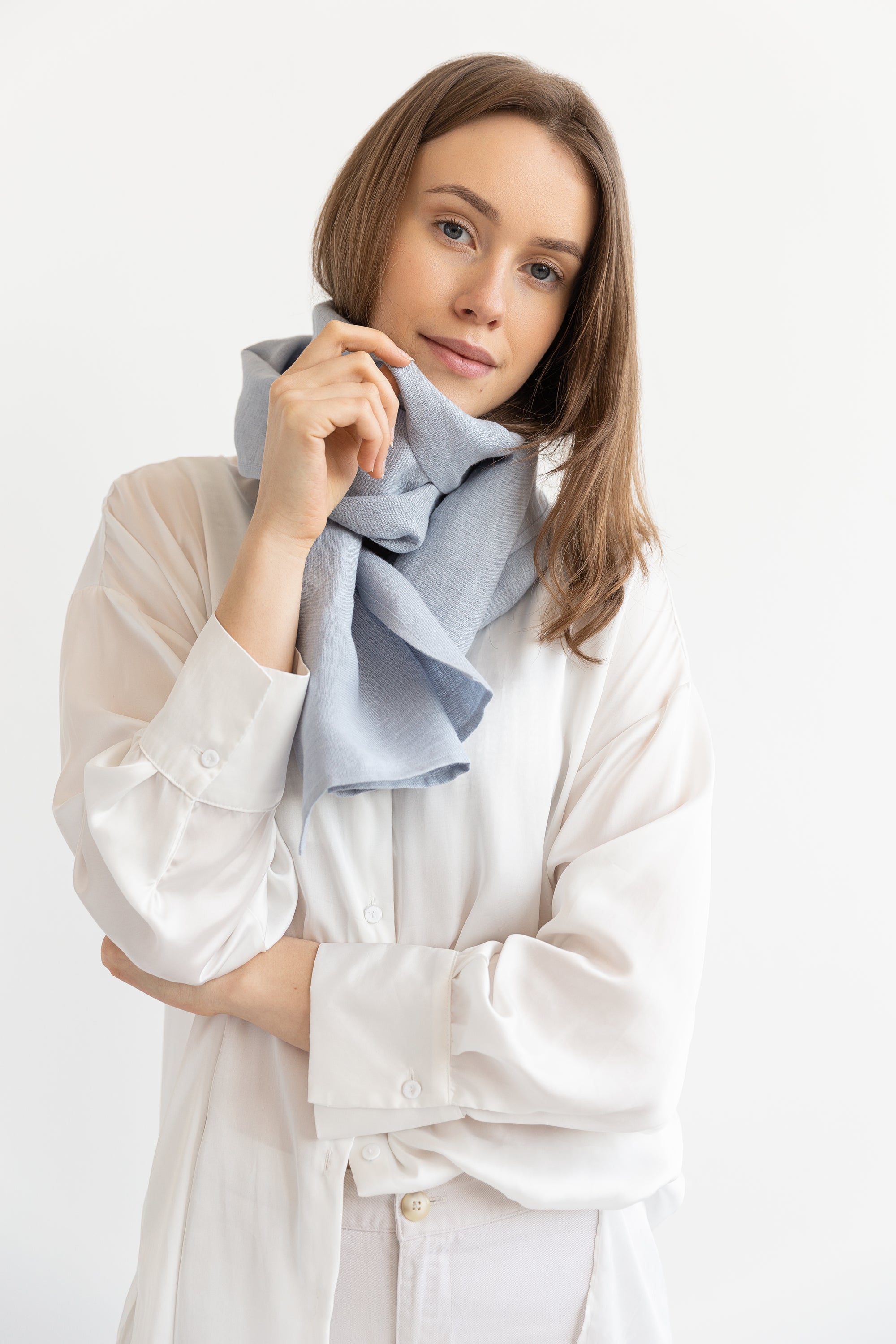 Sky Blue linen scarf made from 100% stonewashed linen, featuring a soft texture and available in two sizes with stylish hem or tassels.