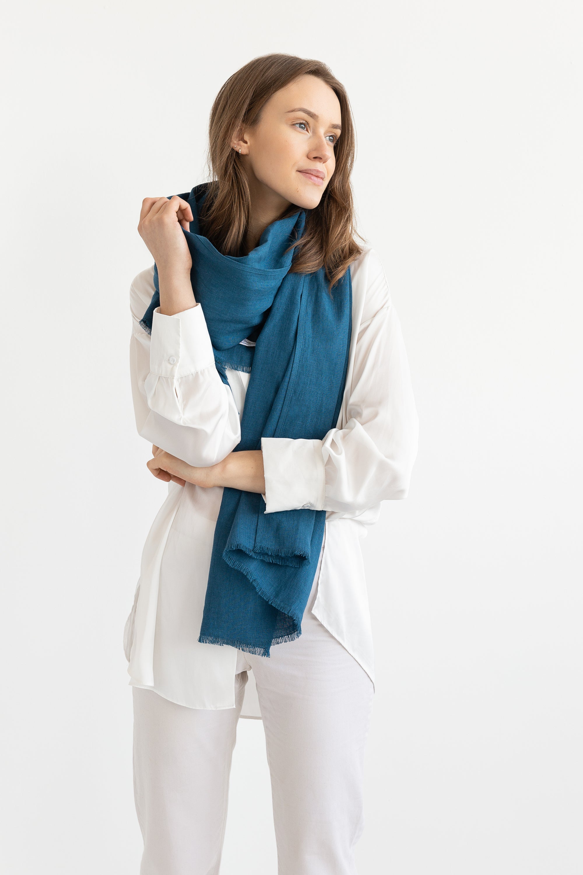 Sky Blue linen scarf made from 100% stonewashed linen, featuring a soft texture and available in two sizes with stylish hem or tassels.