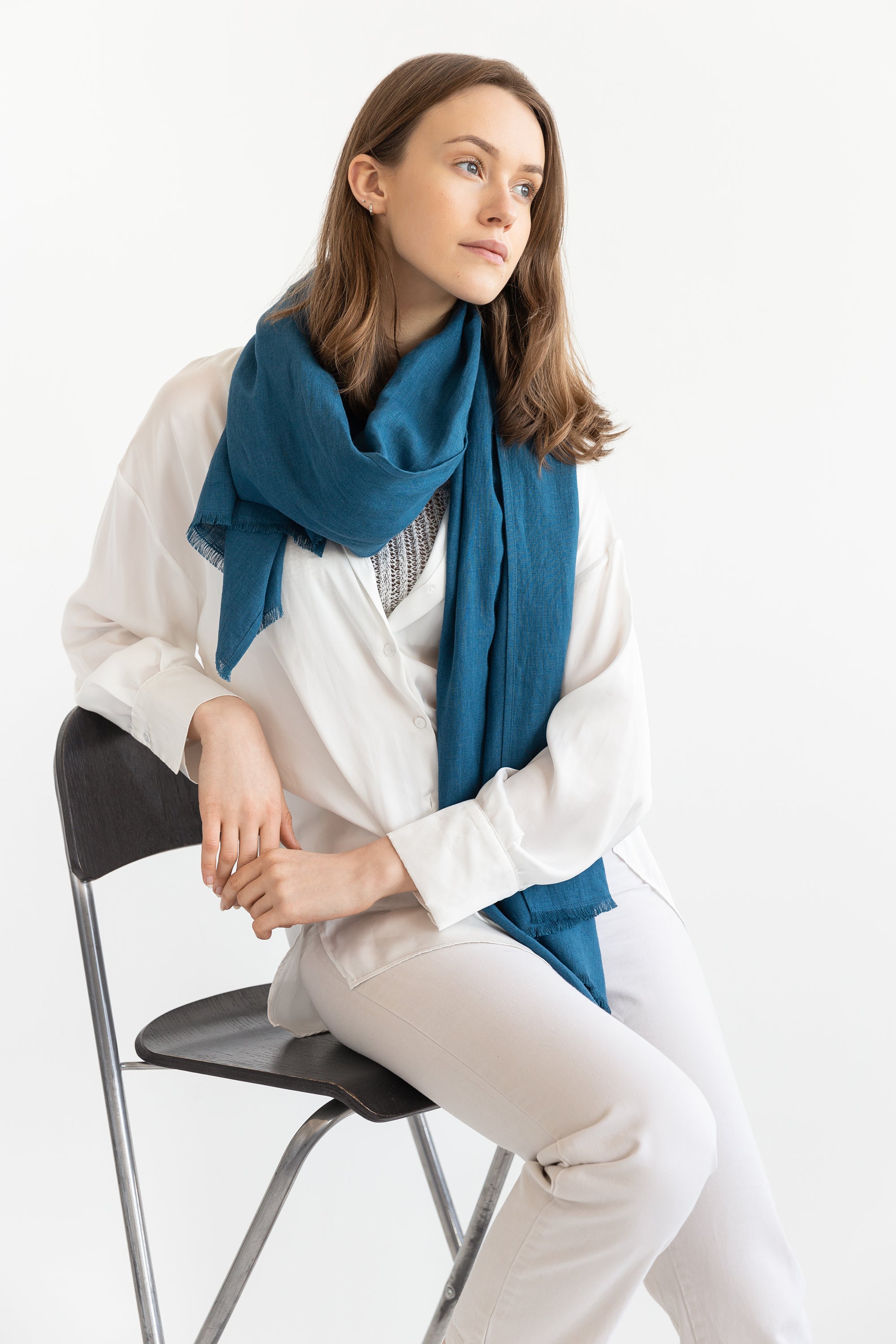 Sky Blue linen scarf made from 100% stonewashed linen, featuring a soft texture and available in two sizes with stylish hem or tassels.
