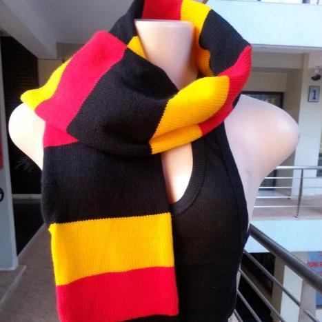 Handwoven multi-colored neck scarf showcasing a classic ribbed stitch design, perfect for winter wear.