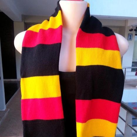 Handwoven multi-colored neck scarf showcasing a classic ribbed stitch design, perfect for winter wear.