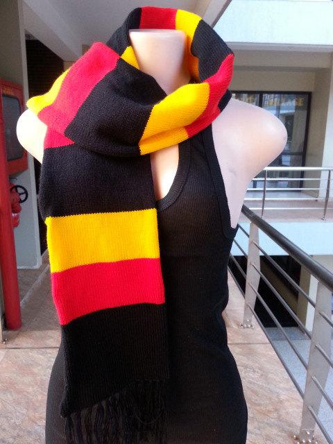 Handwoven multi-colored neck scarf showcasing a classic ribbed stitch design, perfect for winter wear.