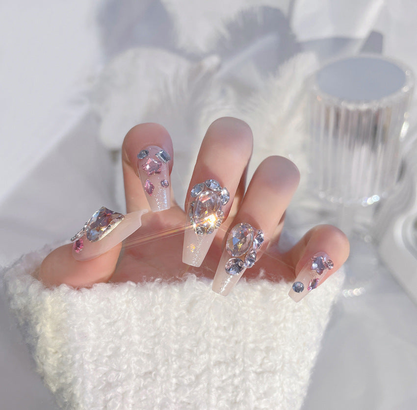 A set of 24 sparkling gem fake nails displayed in an elegant arrangement, showcasing their vibrant colors and dazzling designs.