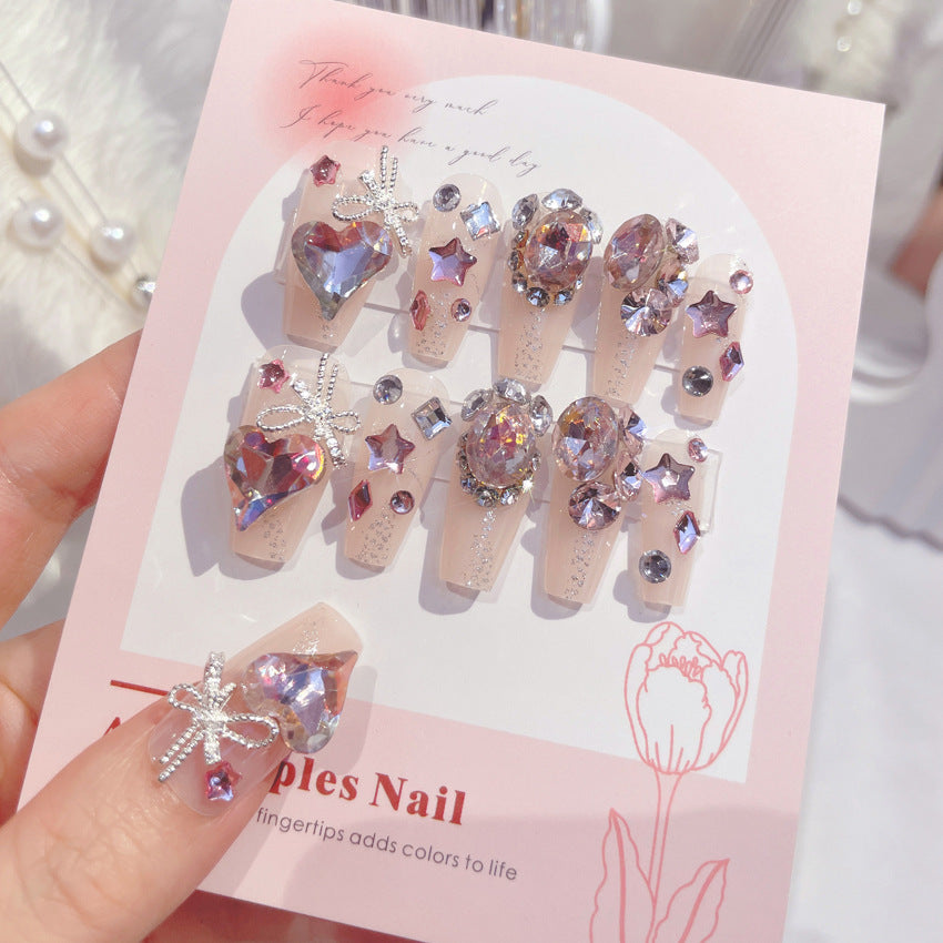 A set of 24 sparkling gem fake nails displayed in an elegant arrangement, showcasing their vibrant colors and dazzling designs.