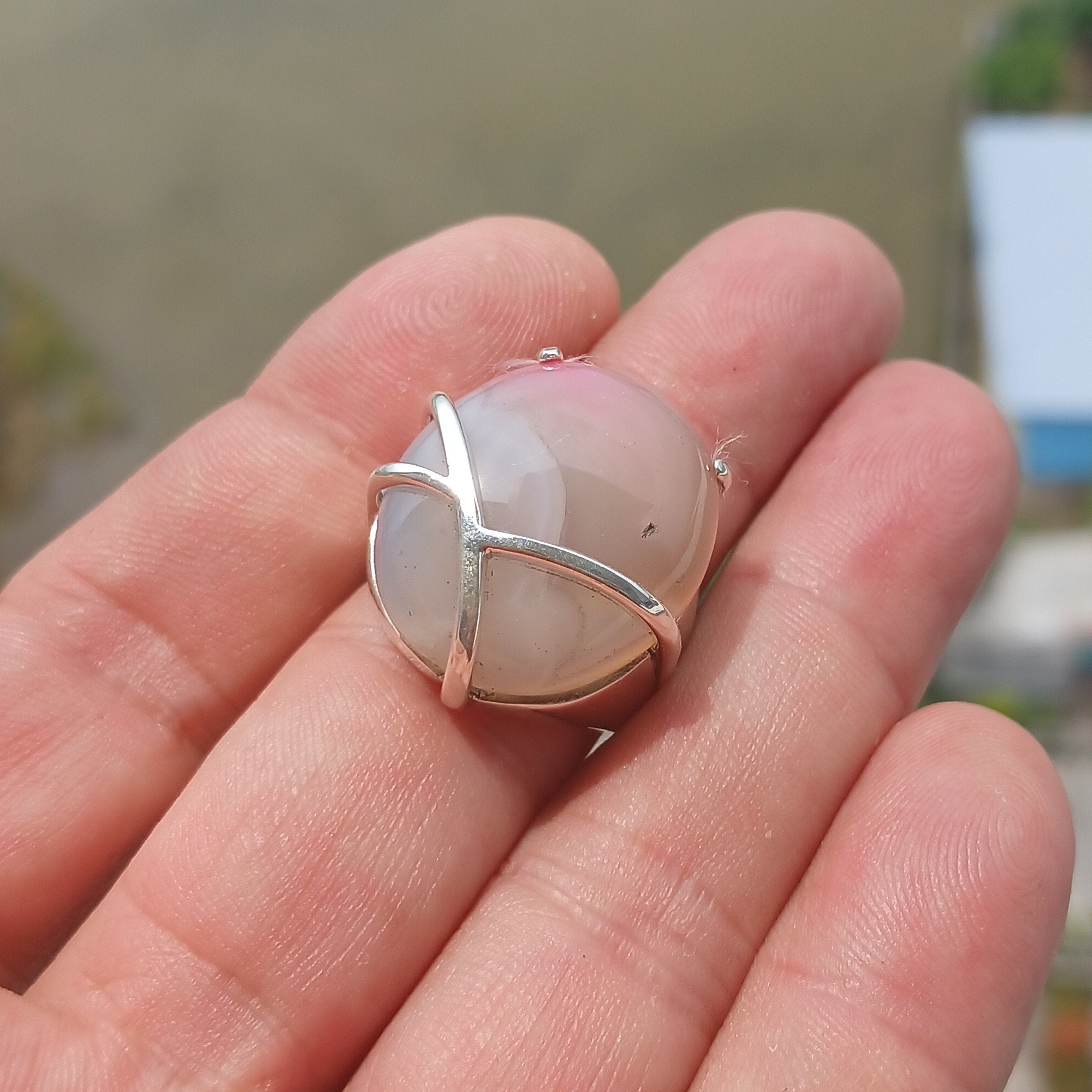 Artistic Agate Silver Ring featuring an oval-shaped white and pink Agate Cabochon set in polished sterling silver.