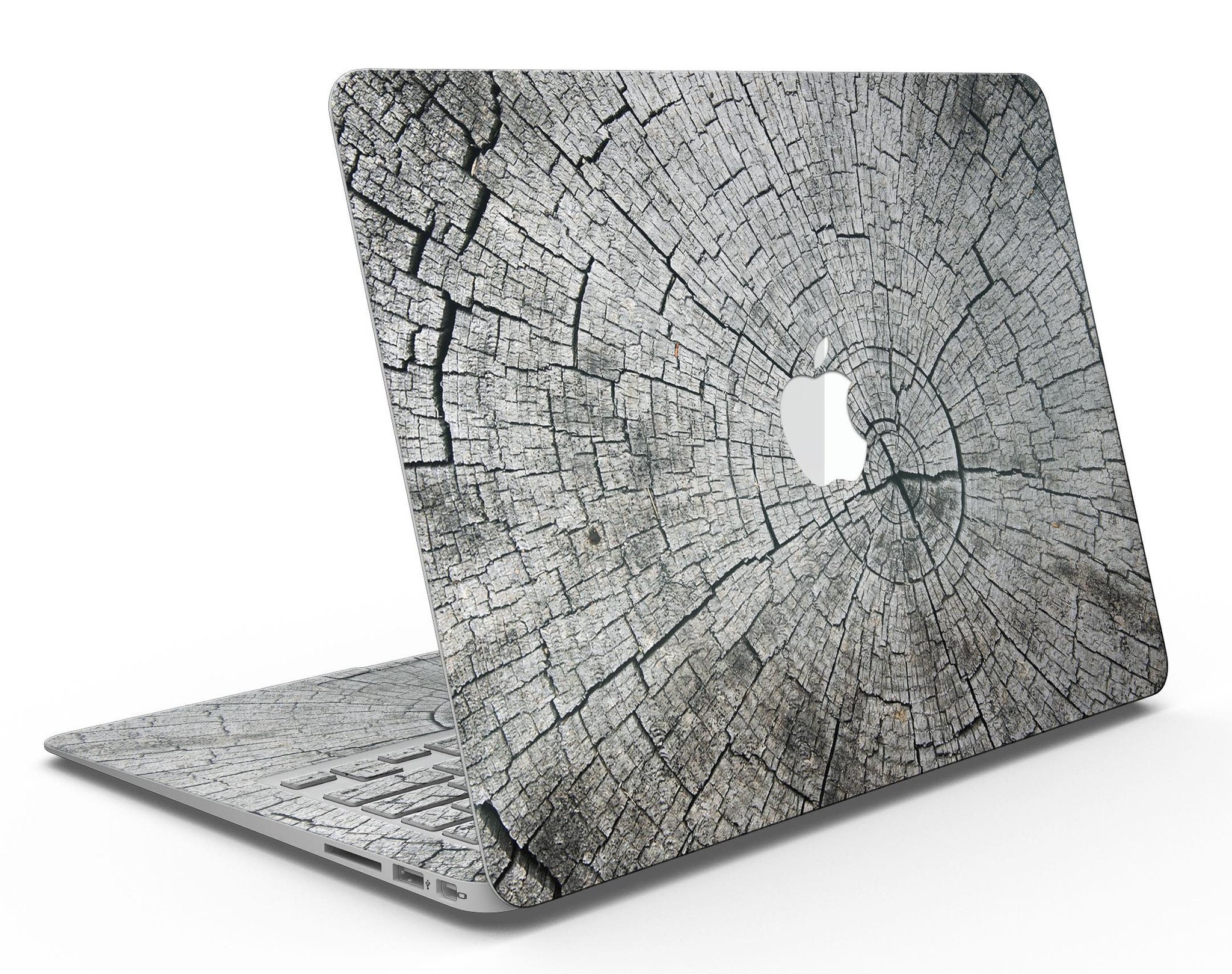 Aged Cracked Tree Stump Core skin applied on a MacBook Air, showcasing its unique design and texture.