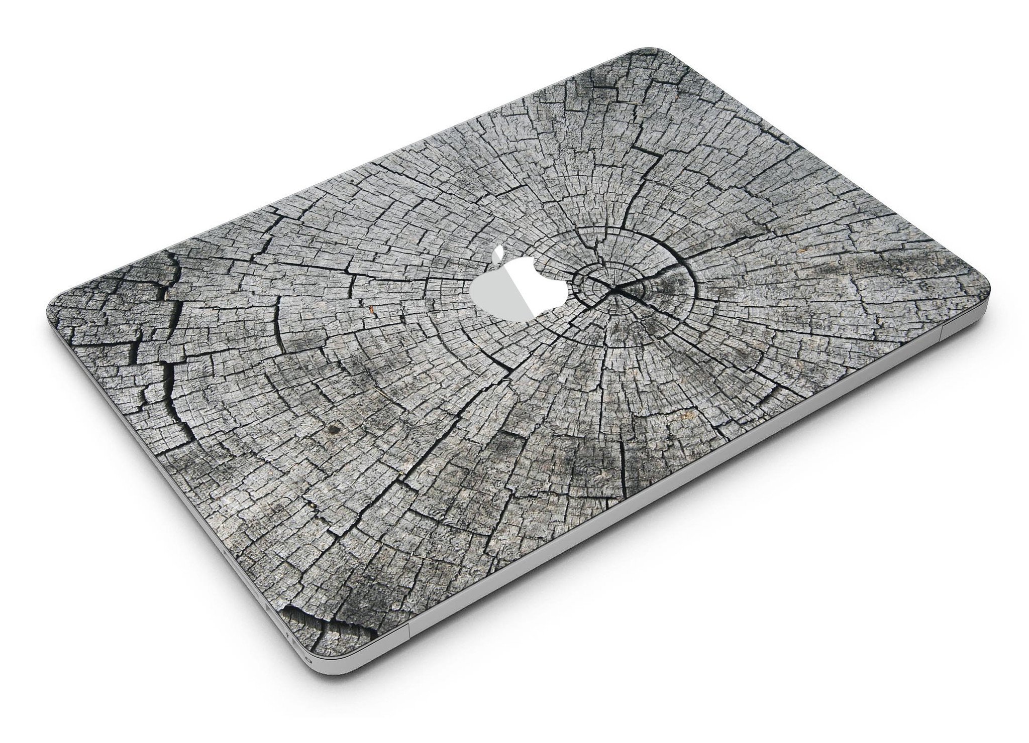 Aged Cracked Tree Stump Core skin applied on a MacBook Air, showcasing its unique design and texture.