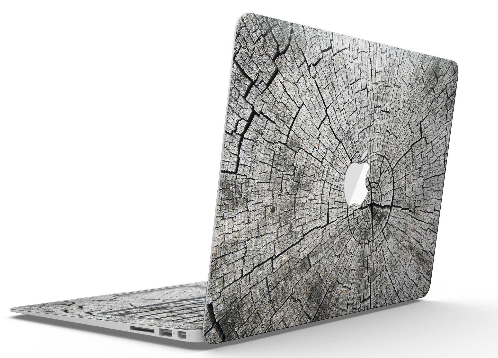 Aged Cracked Tree Stump Core skin applied on a MacBook Air, showcasing its unique design and texture.