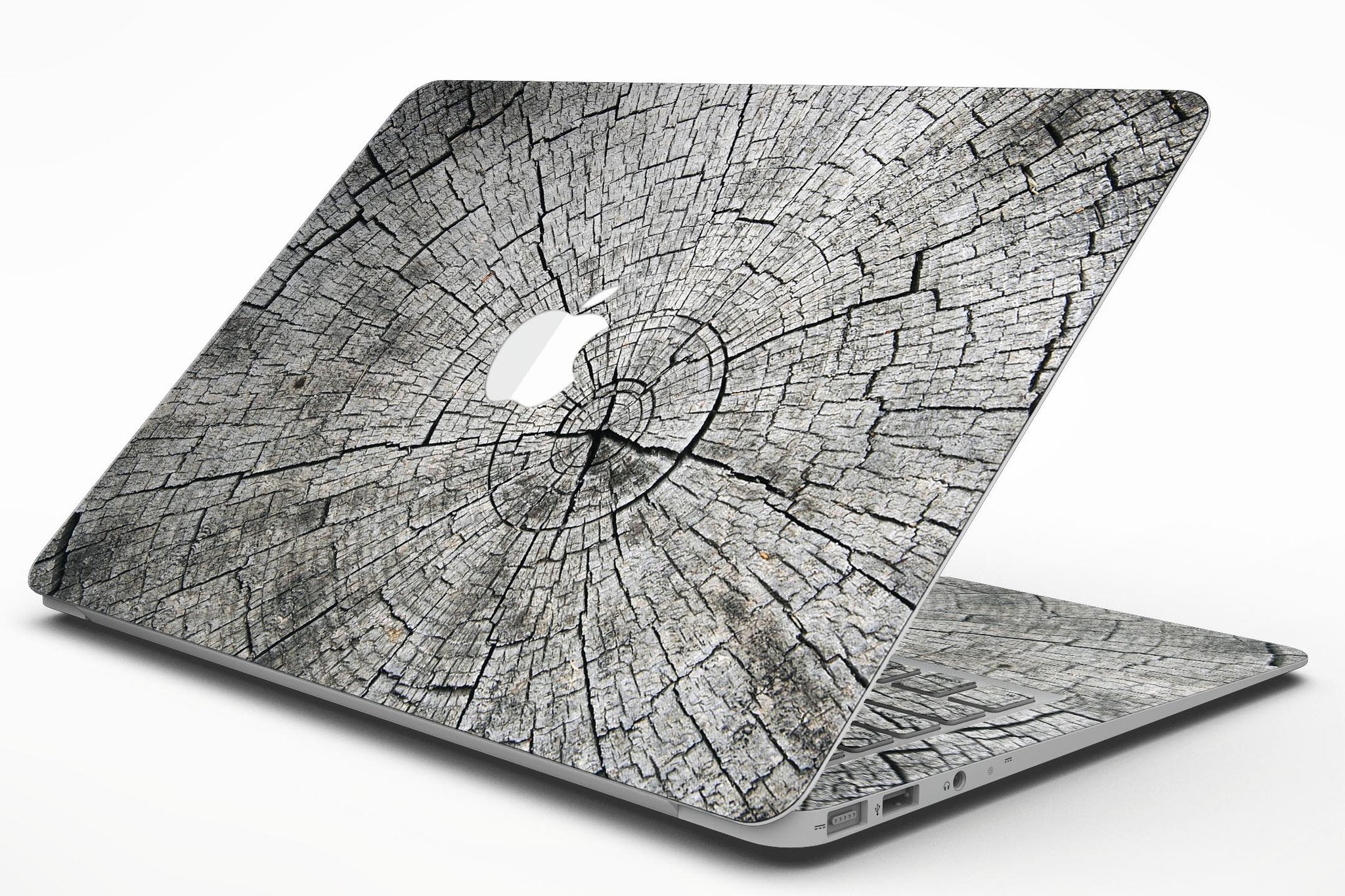 Aged Cracked Tree Stump Core skin applied on a MacBook Air, showcasing its unique design and texture.