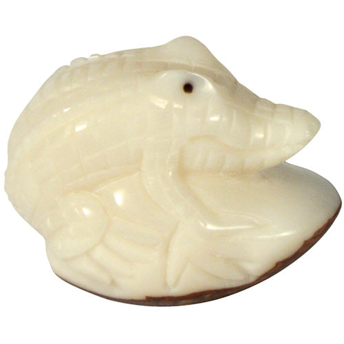 Hand-carved Alligator figurine made from tagua nuts, showcasing intricate details and natural colors, symbolizing eco-friendly craftsmanship.