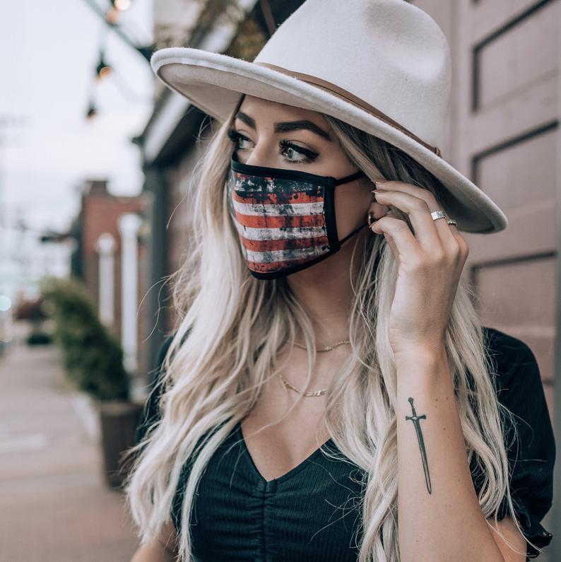 American Distressed Flag Panel mouth cover, featuring a vibrant flag design, adjustable ear loops, and made from soft cotton for comfort.