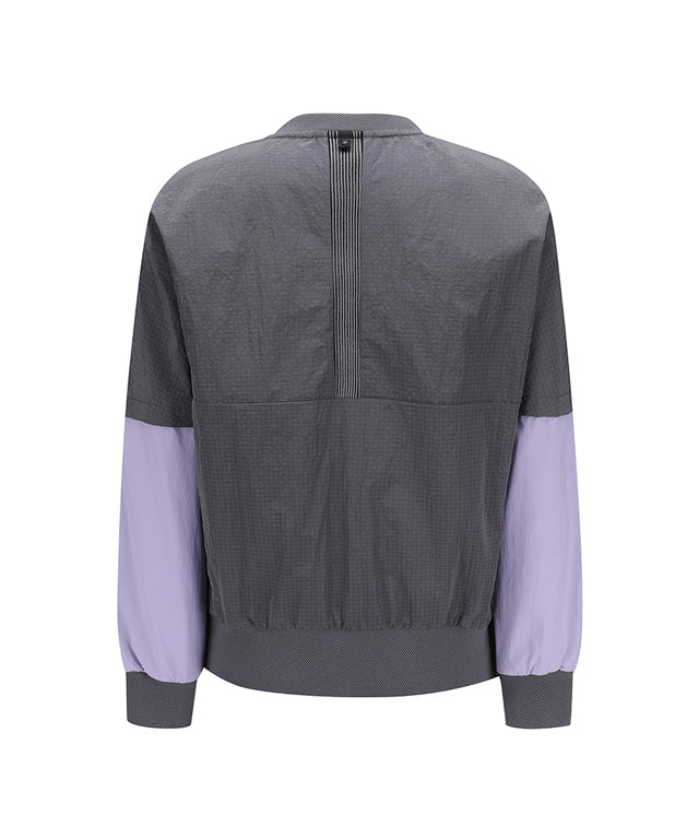 ANEW Golf Women Ribbed Color Block Anorak in Charcoal Gray with lavender accents, showcasing a stylish and functional design.