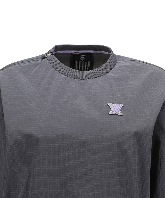 ANEW Golf Women Ribbed Color Block Anorak in Charcoal Gray with lavender accents, showcasing a stylish and functional design.