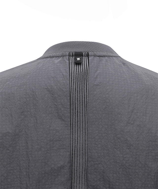 ANEW Golf Women Ribbed Color Block Anorak in Charcoal Gray with lavender accents, showcasing a stylish and functional design.