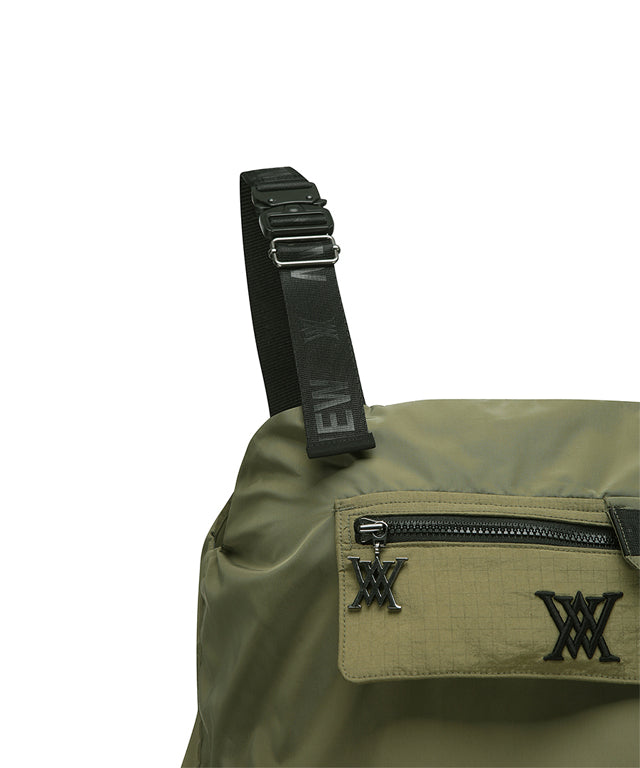 ANEW Golf Women Shoulder Control Band Flaer Lon in Khaki, showcasing adjustable suspender-style design and wide flare bottom.