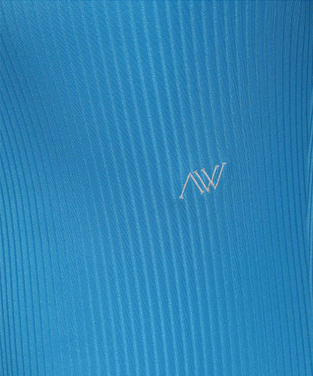 Light blue women's long t-shirt with zipper and ribbed design, perfect for golf and casual wear.