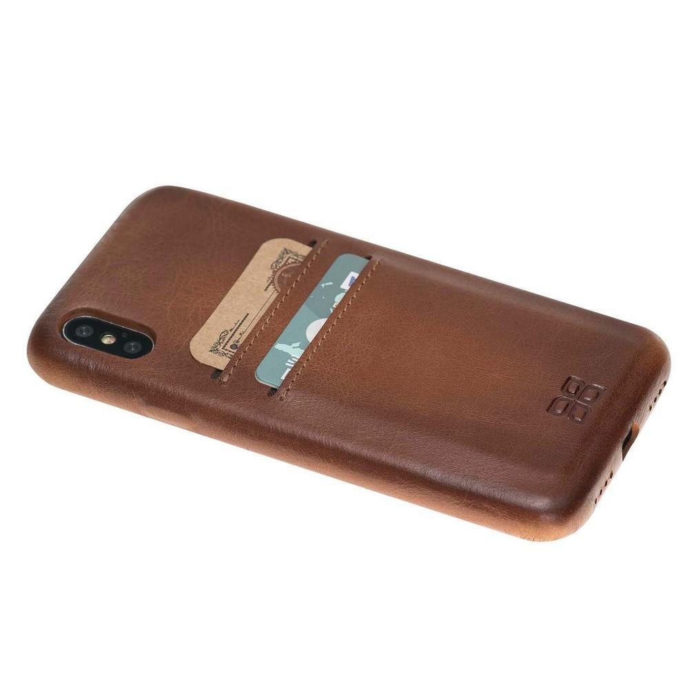 Apple iPhone X Series Leather Ultra Cover in black with credit card slots, showcasing its elegant design and high-quality leather material.