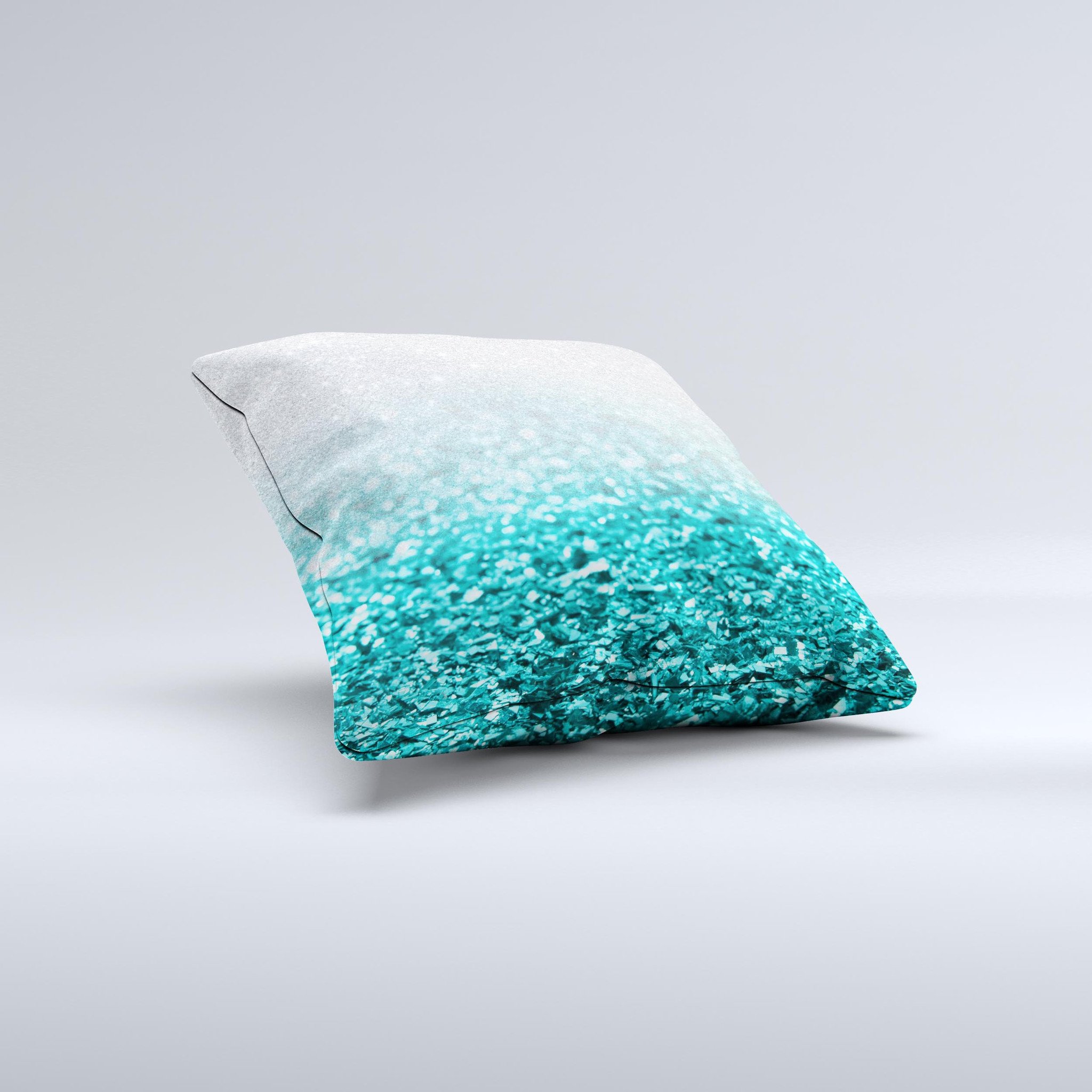Aqua Blue and Silver Glimmer Fade decorative throw pillow, showcasing a unique hand-crafted design with a soft texture.