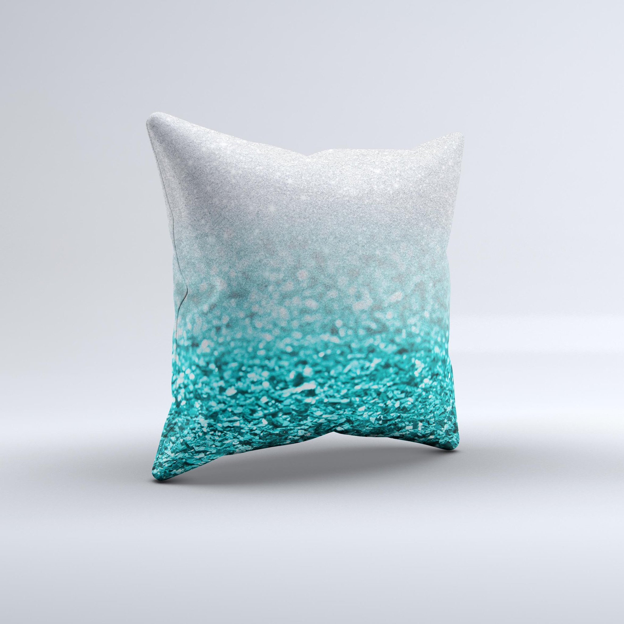 Aqua Blue and Silver Glimmer Fade decorative throw pillow, showcasing a unique hand-crafted design with a soft texture.