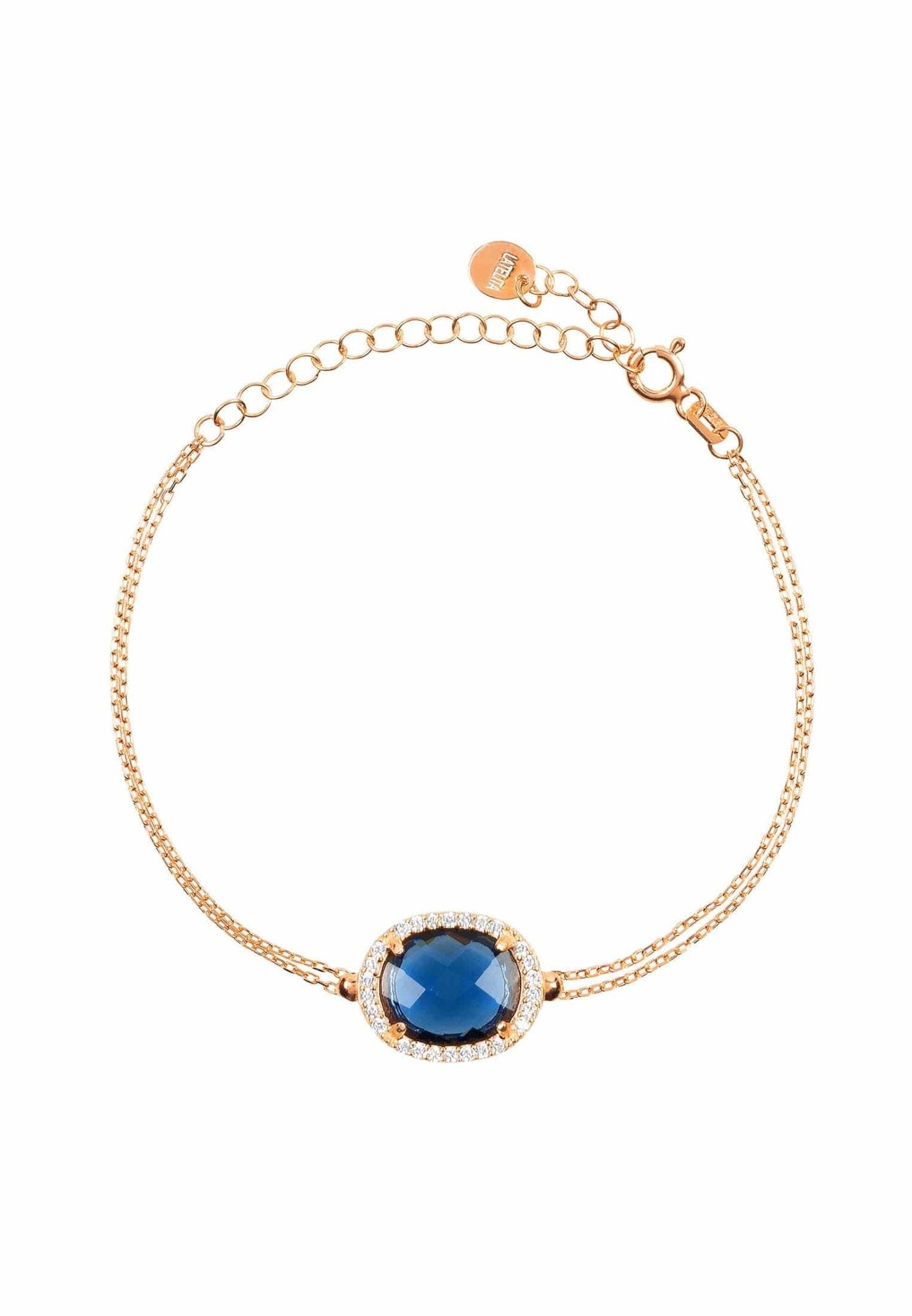 Beatrice Oval Gemstone Bracelet in rose gold featuring a hydro sapphire and cubic zirconia details, showcasing elegance and luxury.