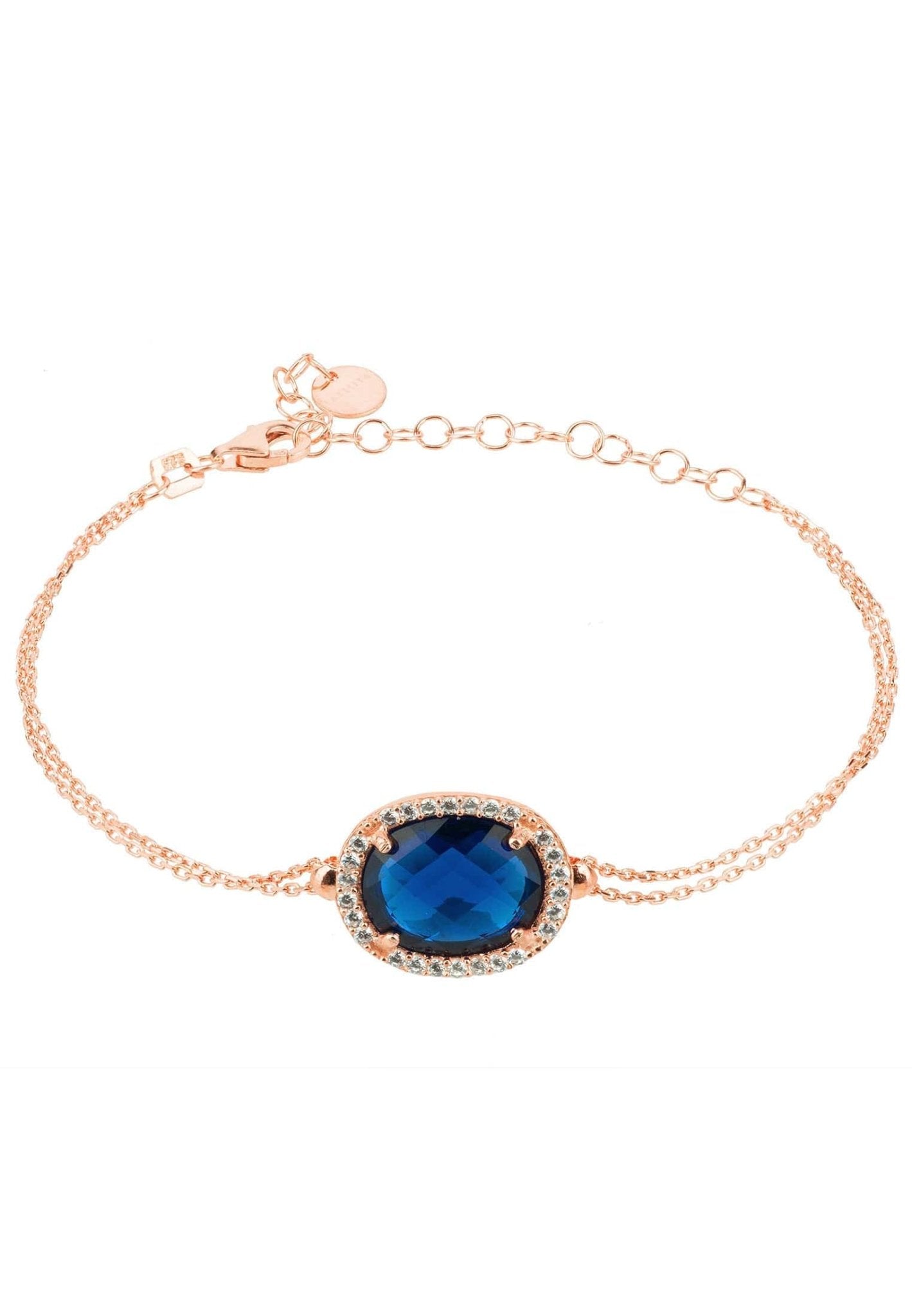 Beatrice Oval Gemstone Bracelet in rose gold featuring a hydro sapphire and cubic zirconia details, showcasing elegance and luxury.