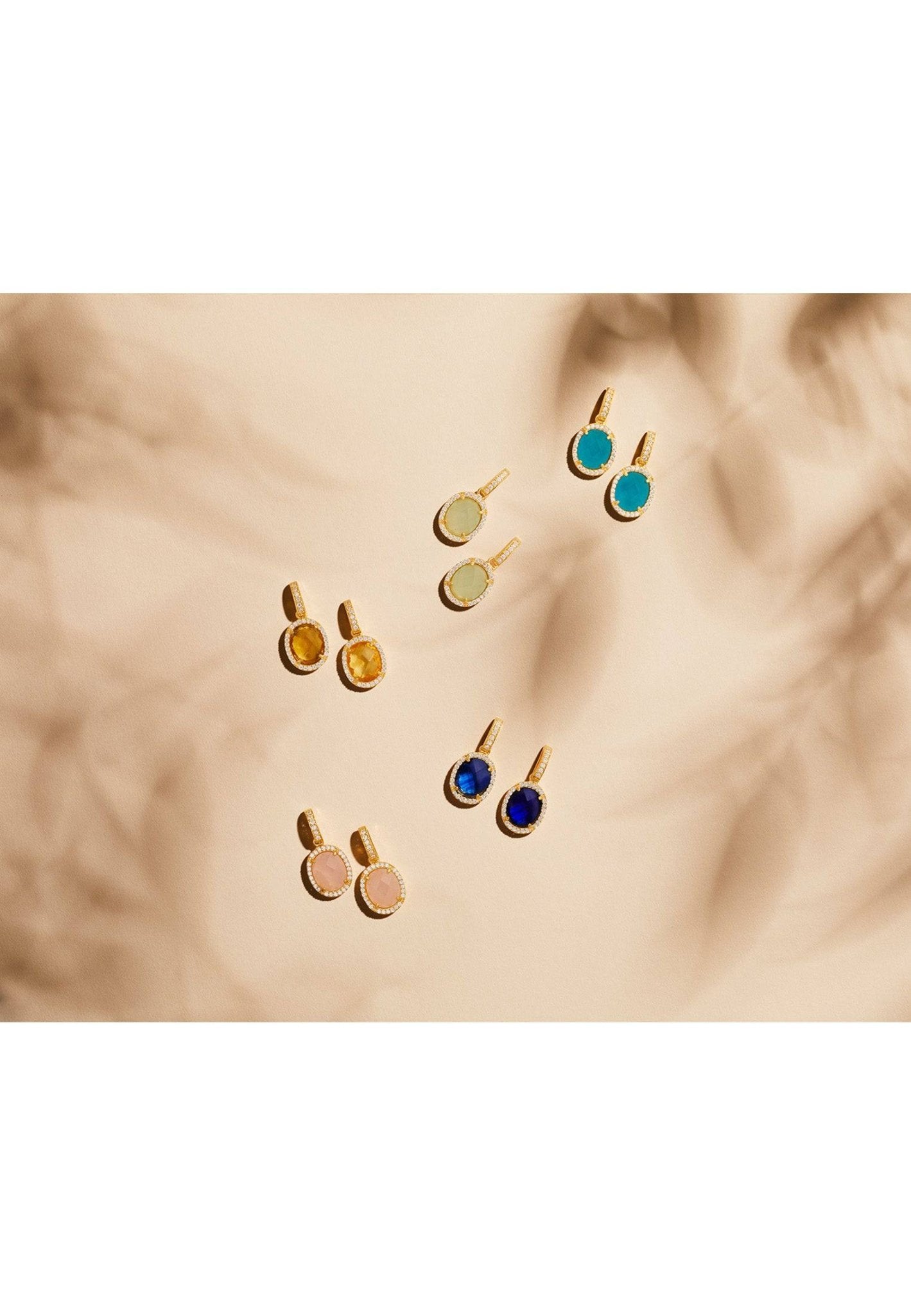 Beatrice Oval Gemstone Drop Earrings featuring sapphire hydro stones and cubic zirconia, elegantly crafted in 22ct gold-dipped sterling silver.