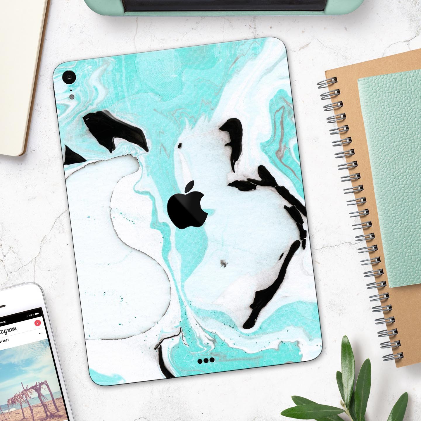 Black and teal textured marble skin decal for Apple devices, showcasing a stylish design and premium quality finish.