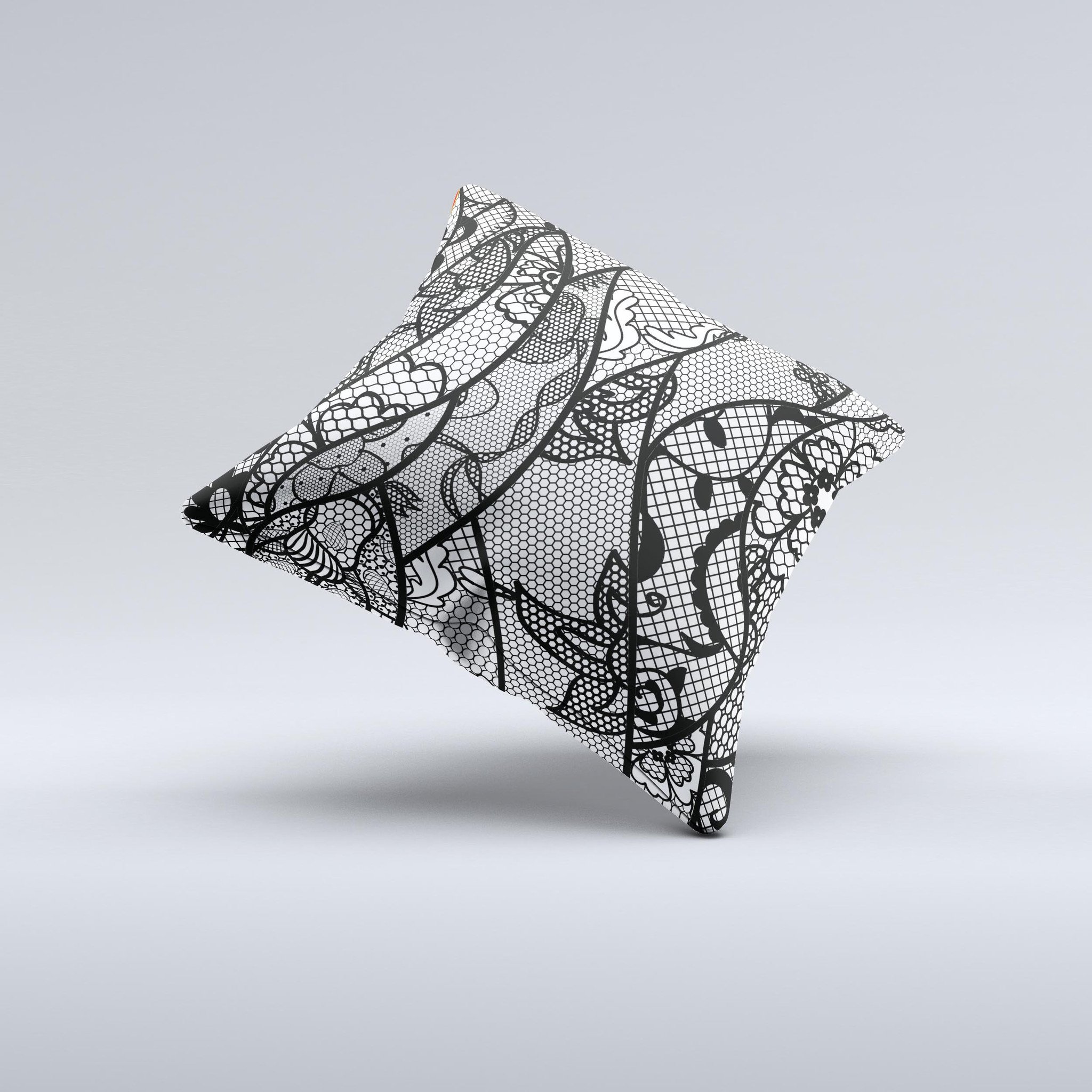 Black and white decorative throw pillow featuring a lace design, handcrafted in Virginia with high thread count fabric and polyester filling.