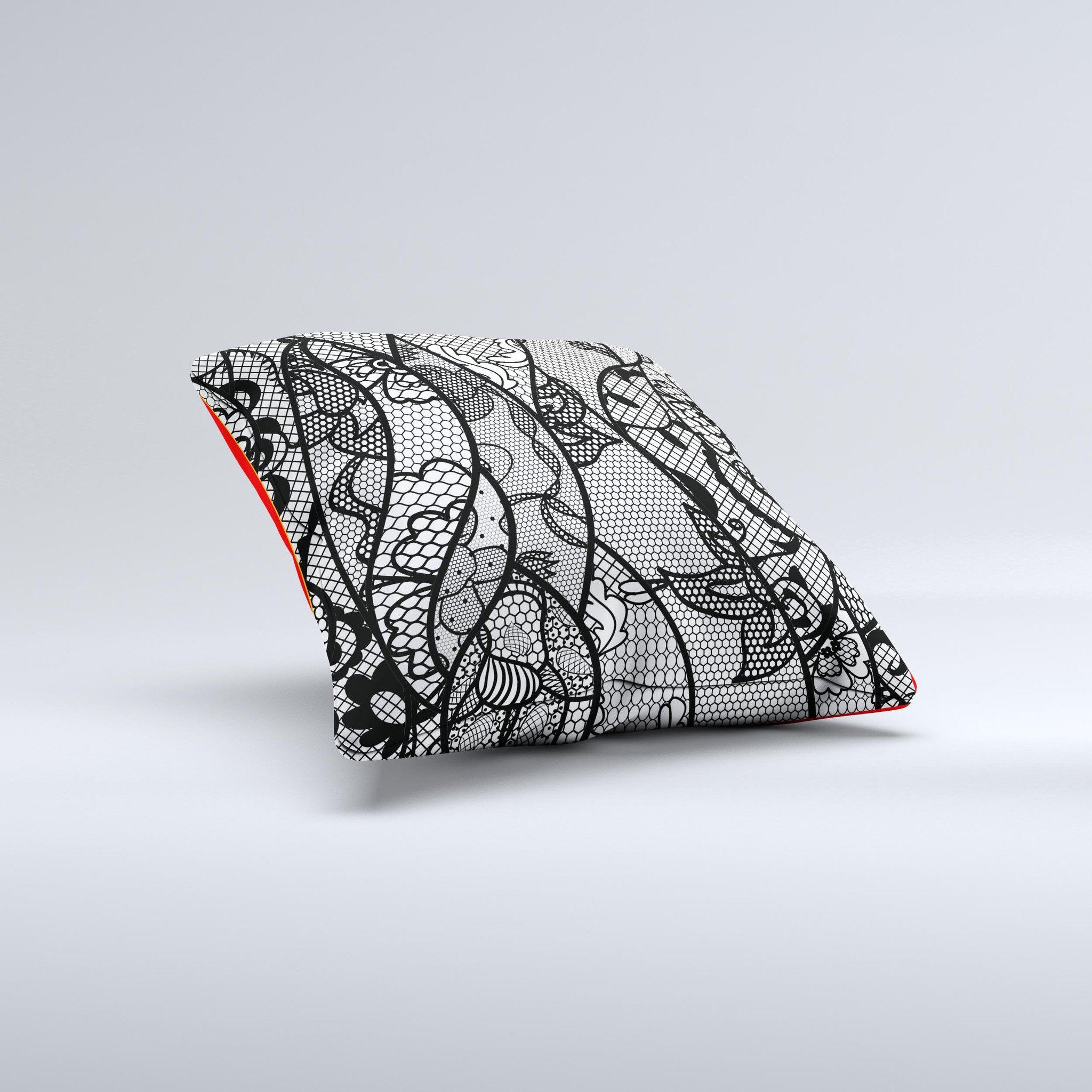 Black and white decorative throw pillow featuring a lace design, handcrafted in Virginia with high thread count fabric and polyester filling.