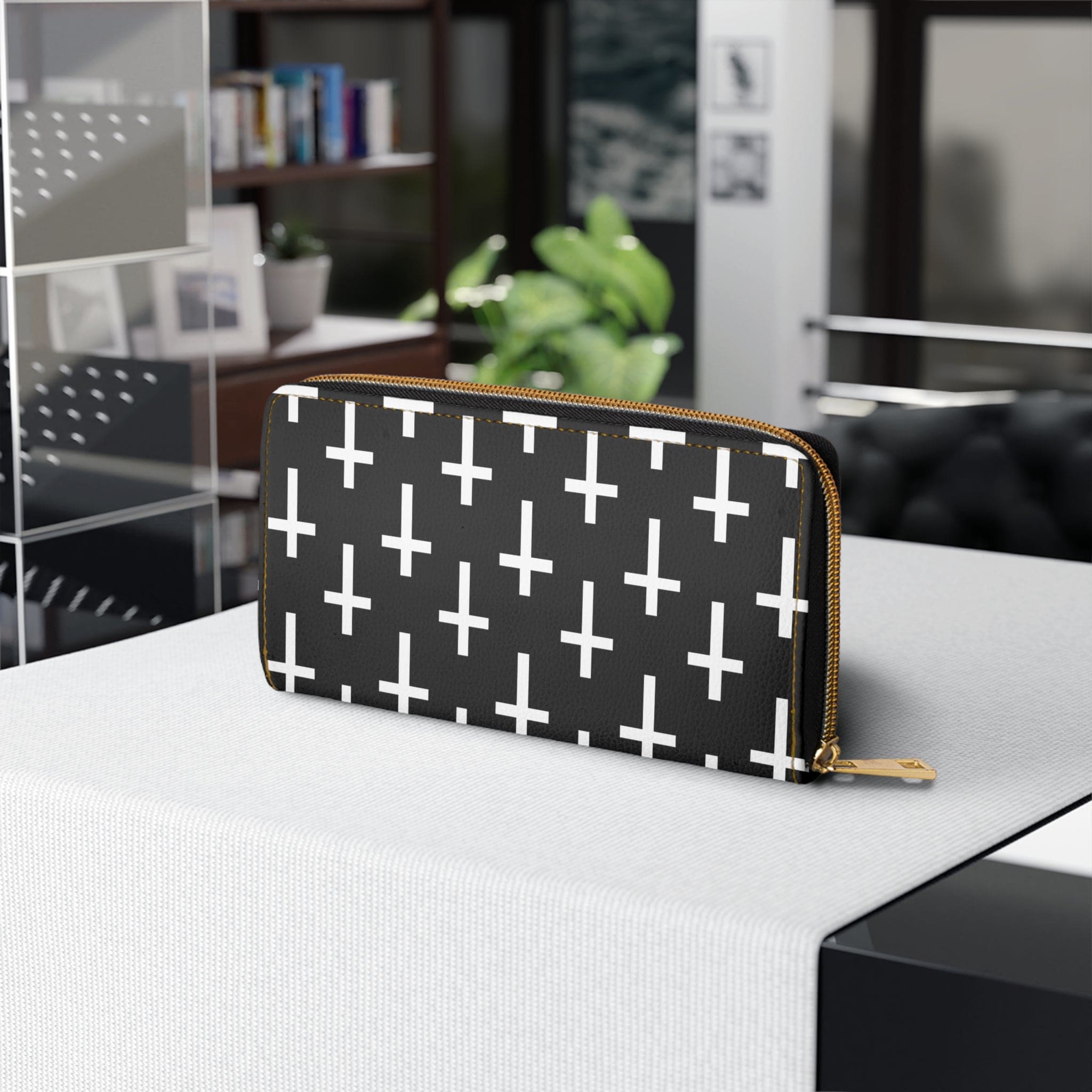 Black and white seamless cross pattern women's zipper wallet clutch showcasing its stylish design and functional compartments.