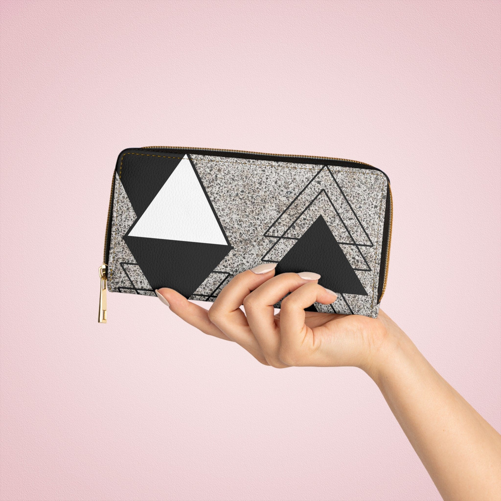 Black and white triangular colorblock women's zipper wallet clutch showcasing its stylish design and functional compartments.