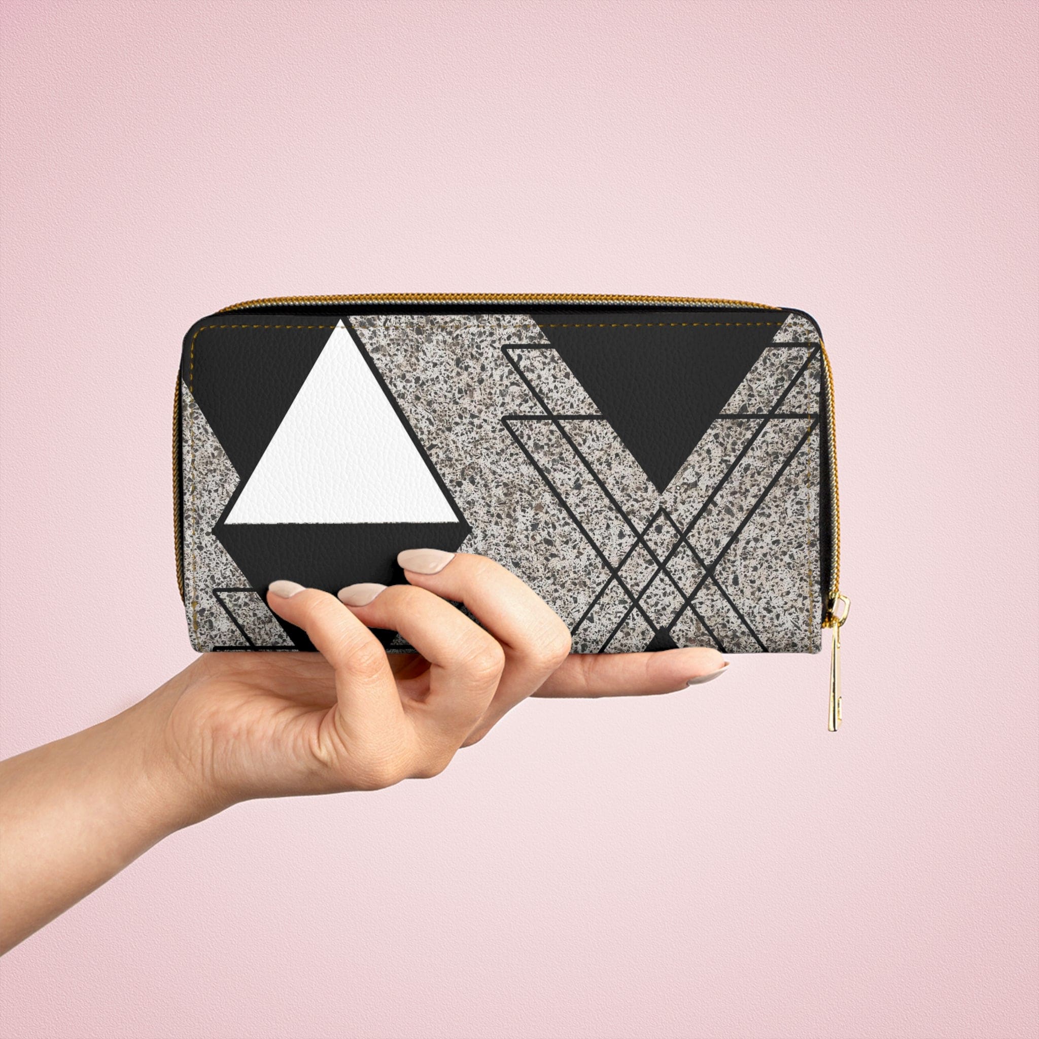 Black and white triangular colorblock women's zipper wallet clutch showcasing its stylish design and functional compartments.