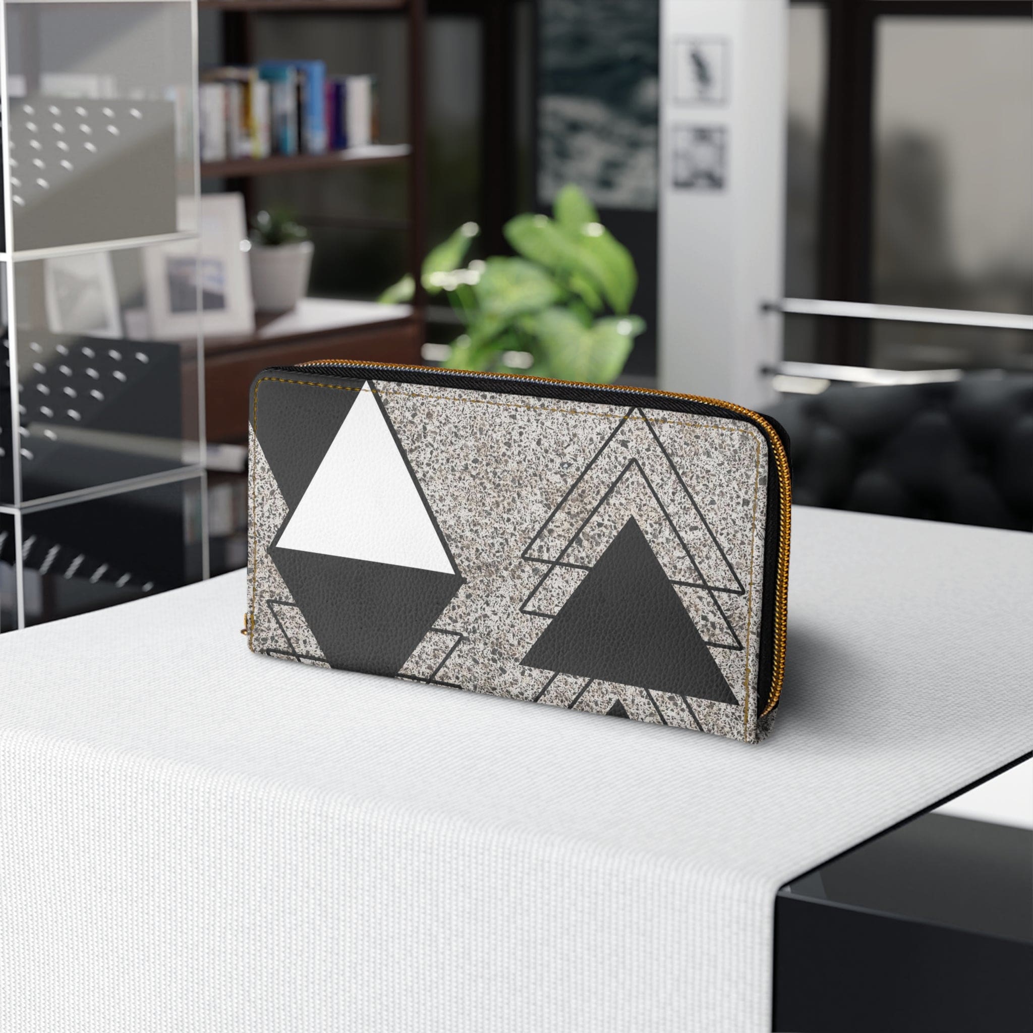 Black and white triangular colorblock women's zipper wallet clutch showcasing its stylish design and functional compartments.
