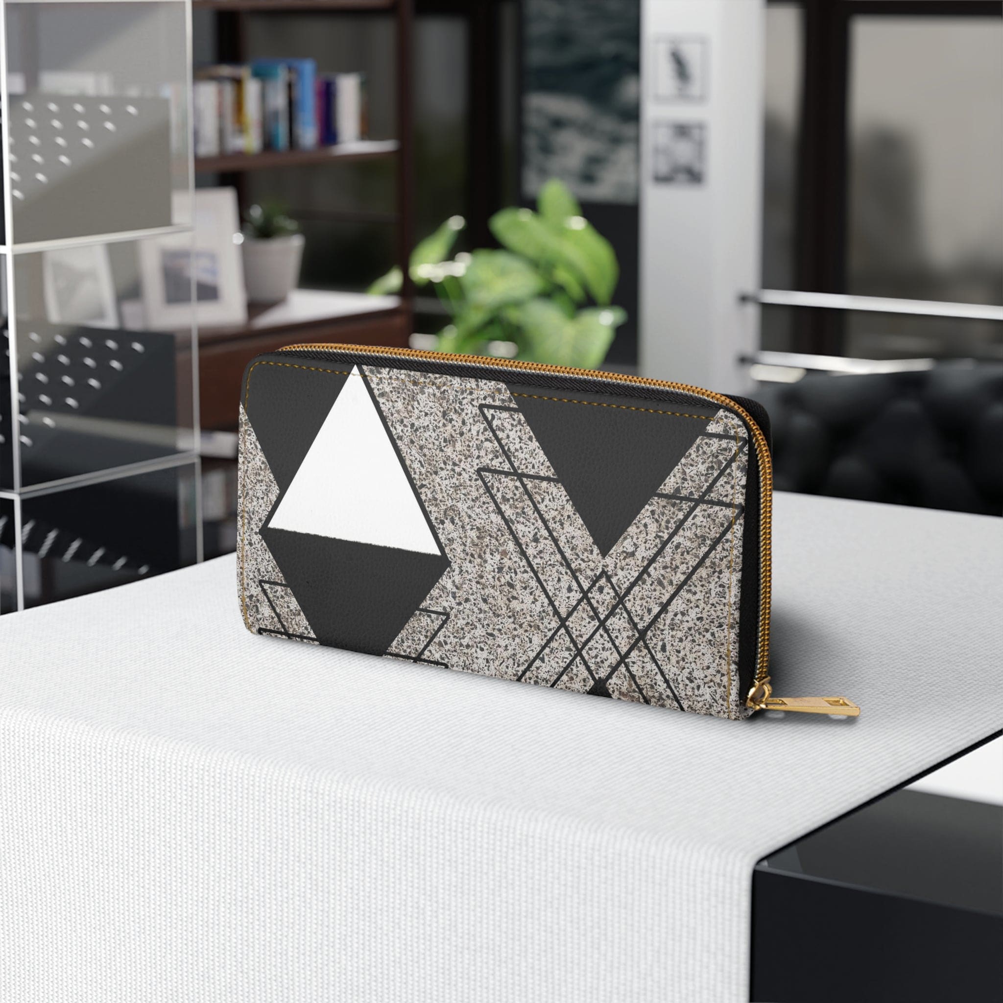 Black and white triangular colorblock women's zipper wallet clutch showcasing its stylish design and functional compartments.