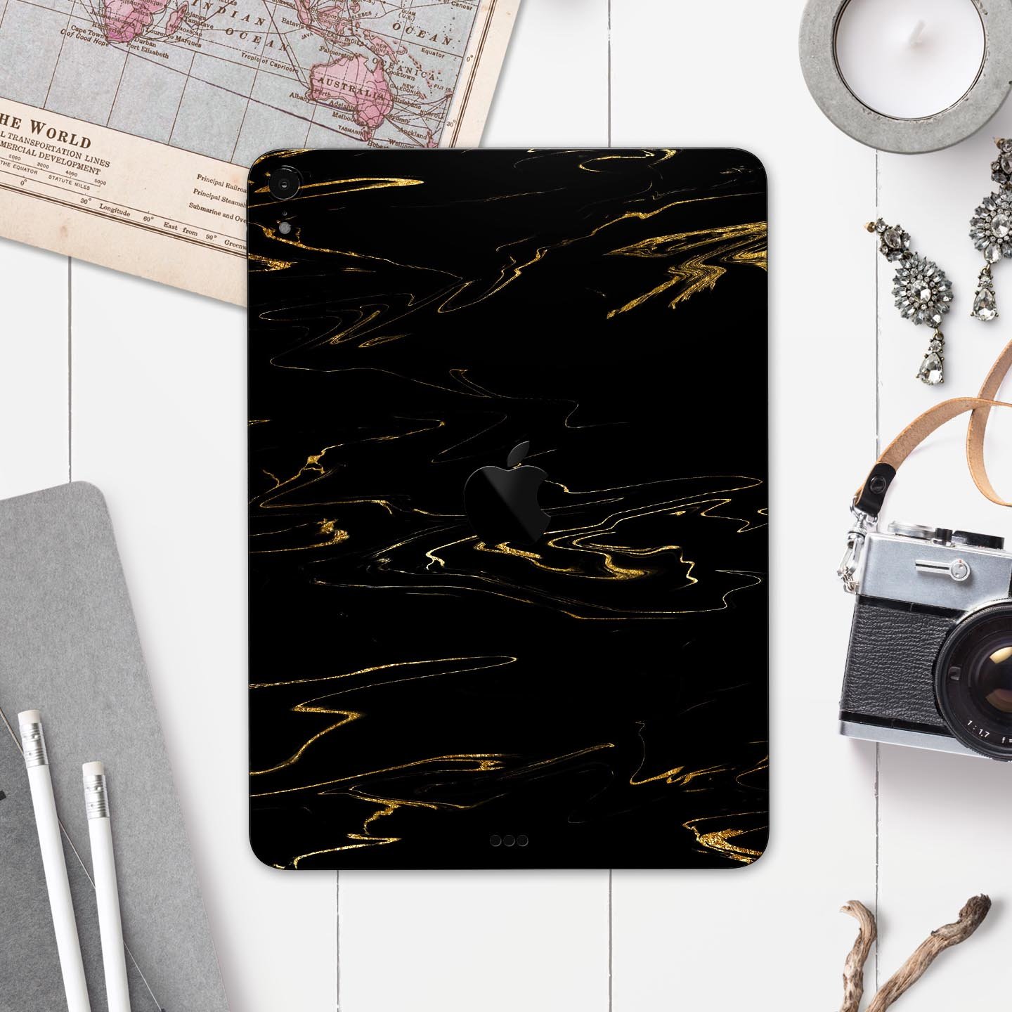 Black & Gold Marble Swirl V10 skin decal for Apple devices, showcasing a stylish marble design with a glossy finish.