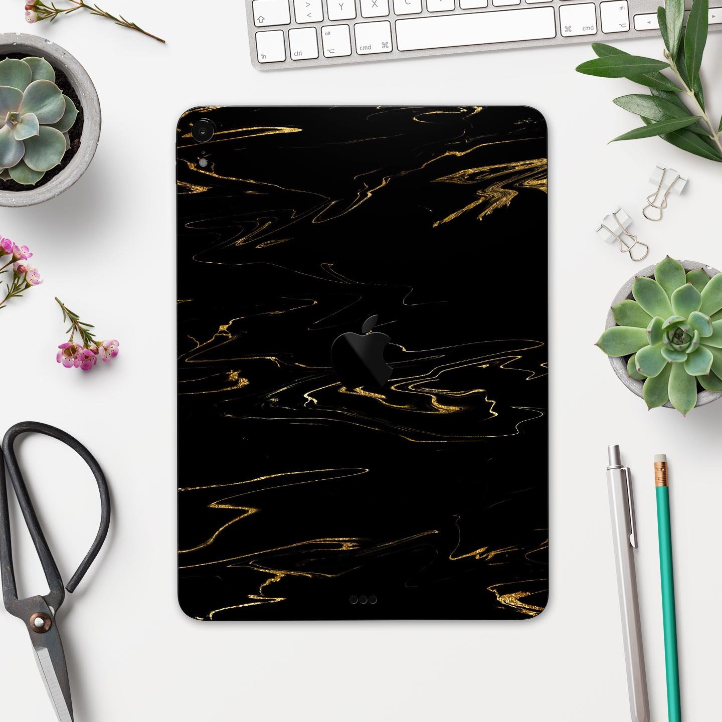 Black & Gold Marble Swirl V10 skin decal for Apple devices, showcasing a stylish marble design with a glossy finish.