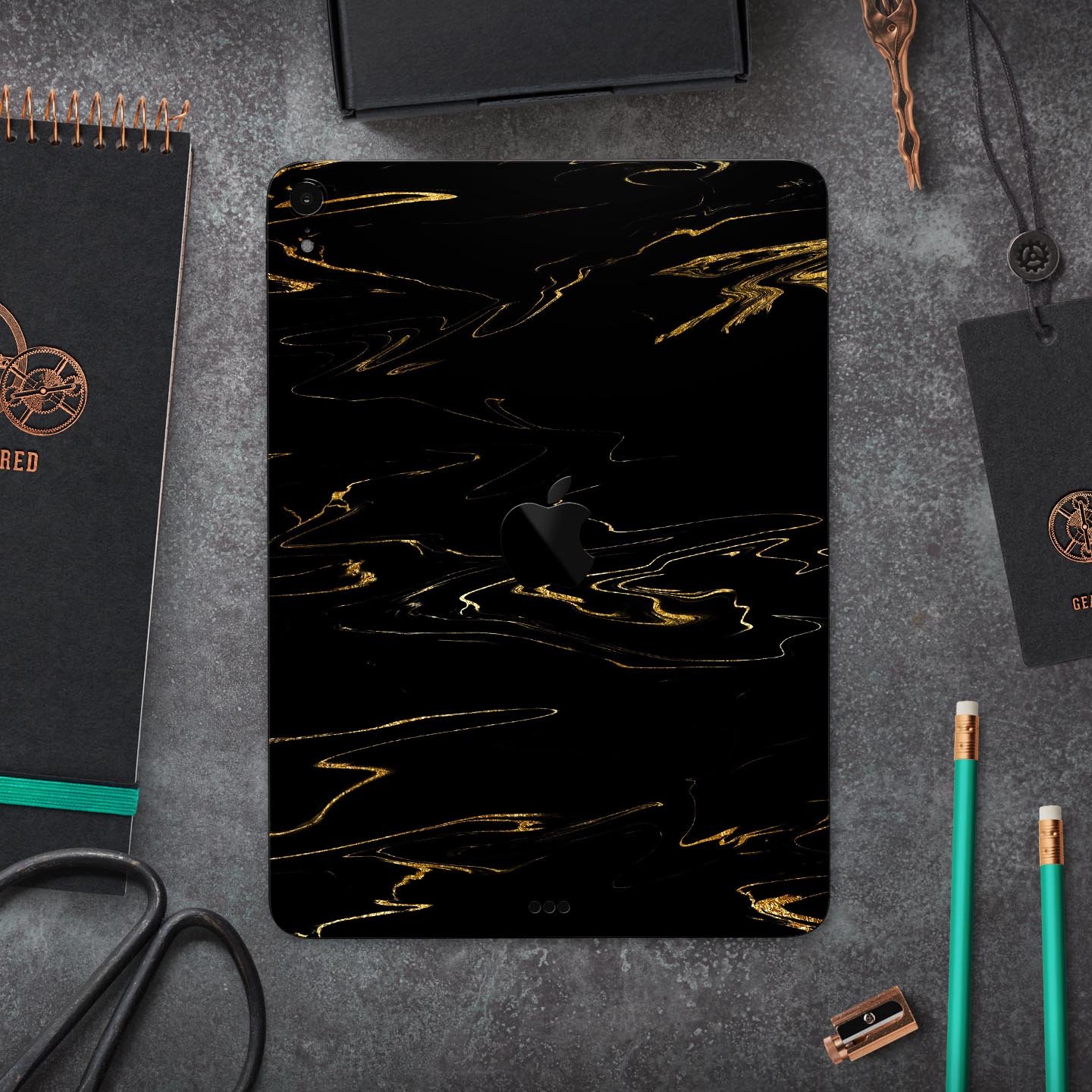 Black & Gold Marble Swirl V10 skin decal for Apple devices, showcasing a stylish marble design with a glossy finish.