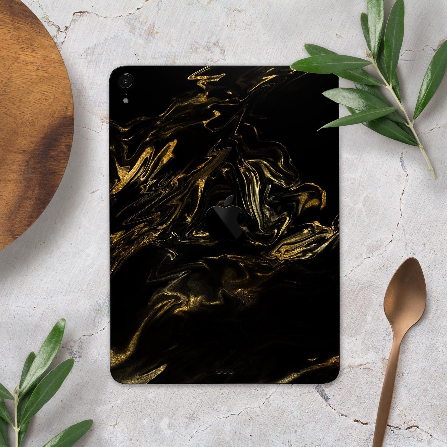 Black and gold marble swirl skin decal for Apple iPad, showcasing a stylish design with premium finish.